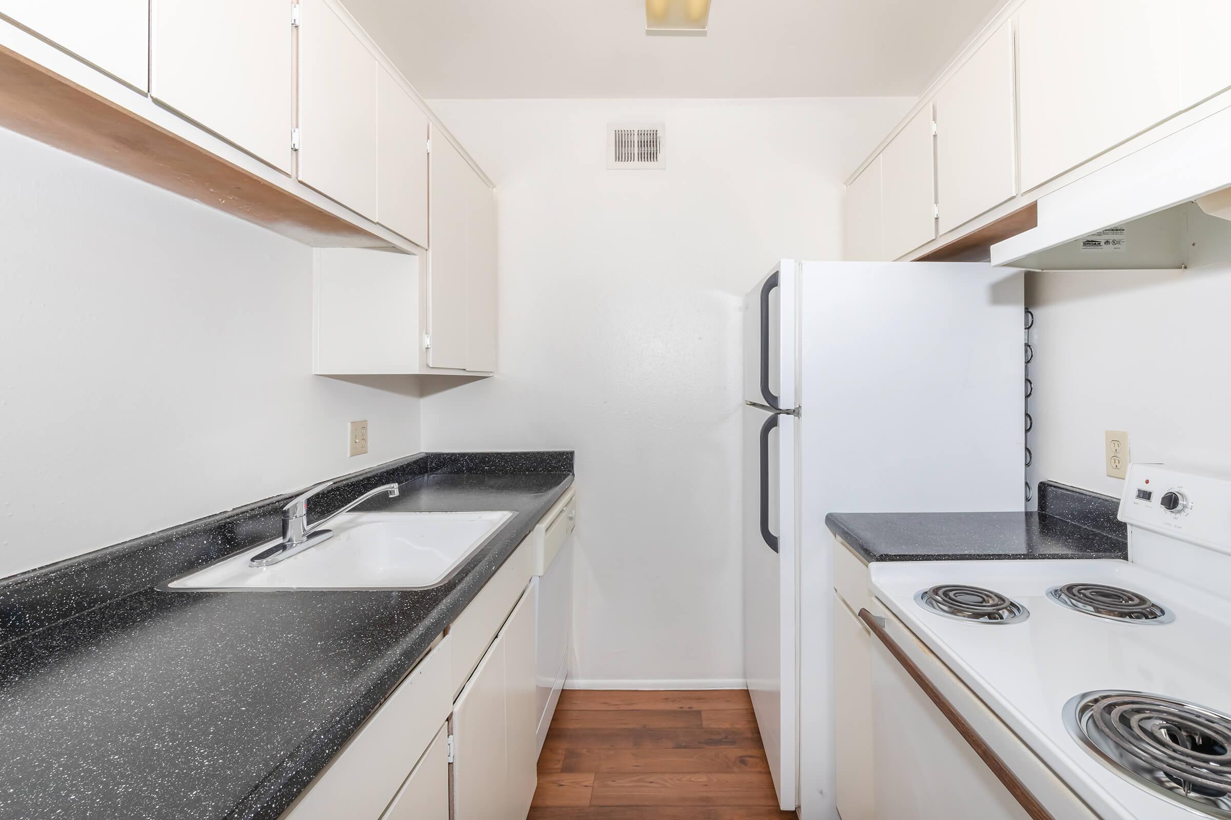 a kitchen with a stove top oven