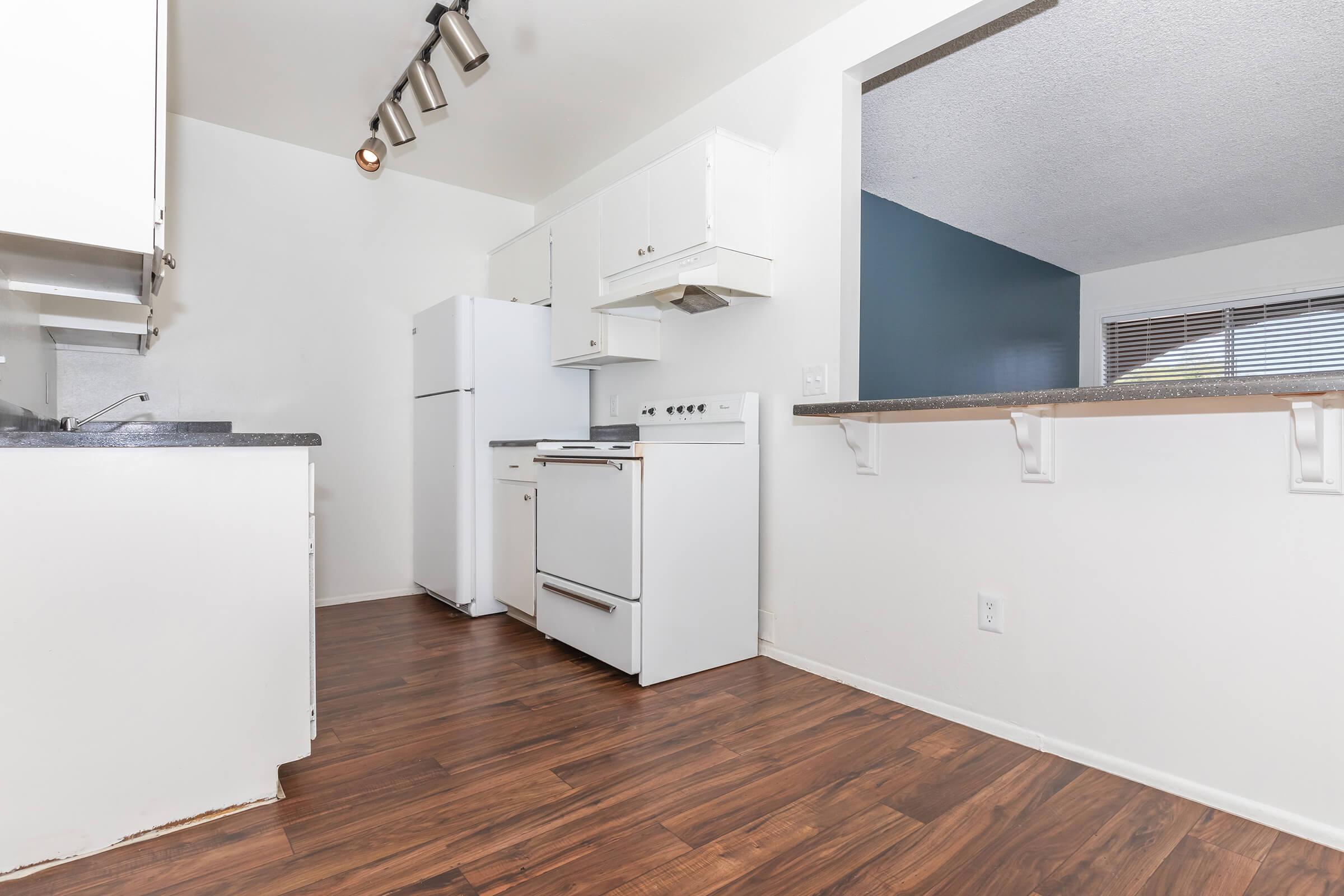 a large white refrigerator in a kitchen