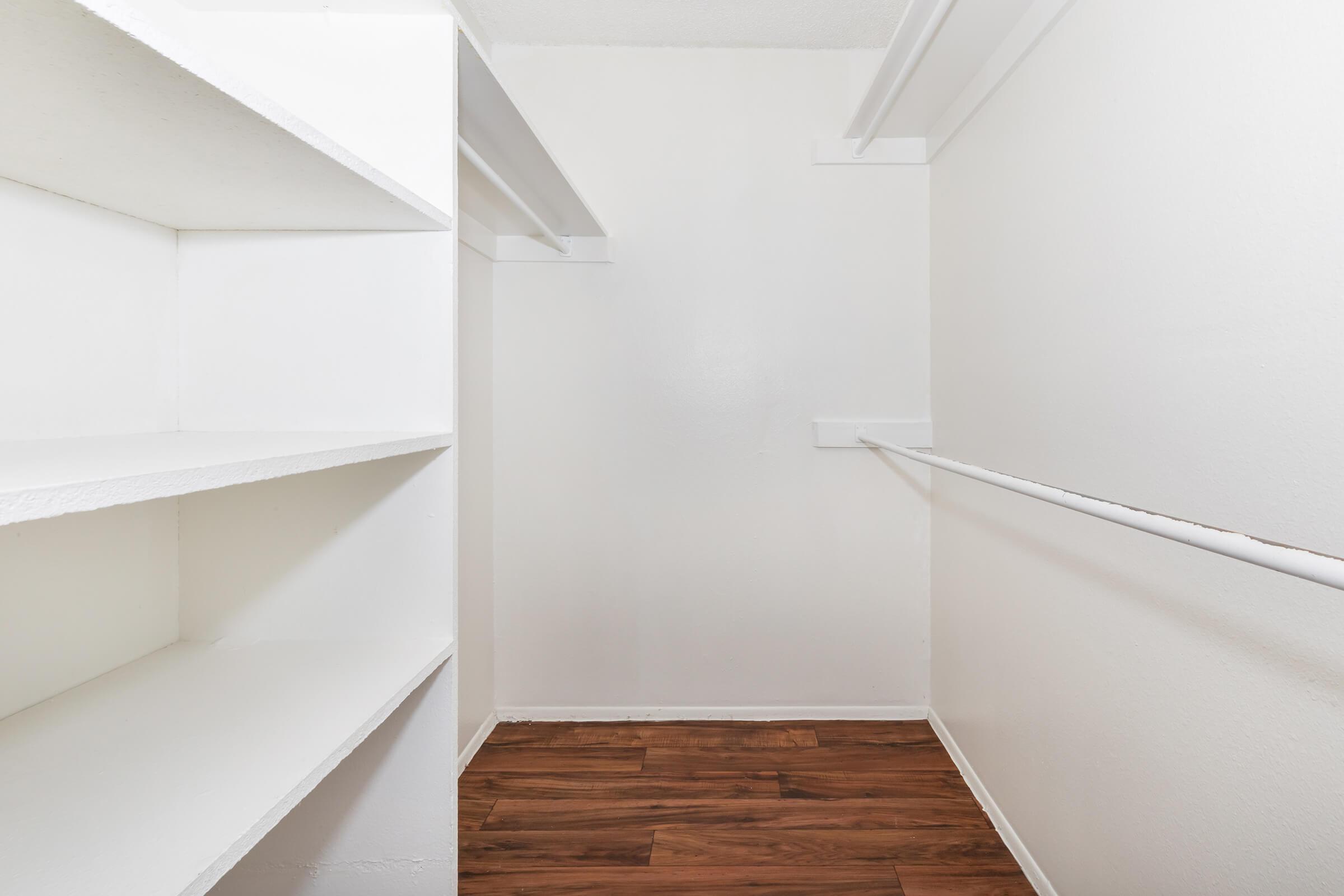 a white refrigerator freezer sitting inside of a building