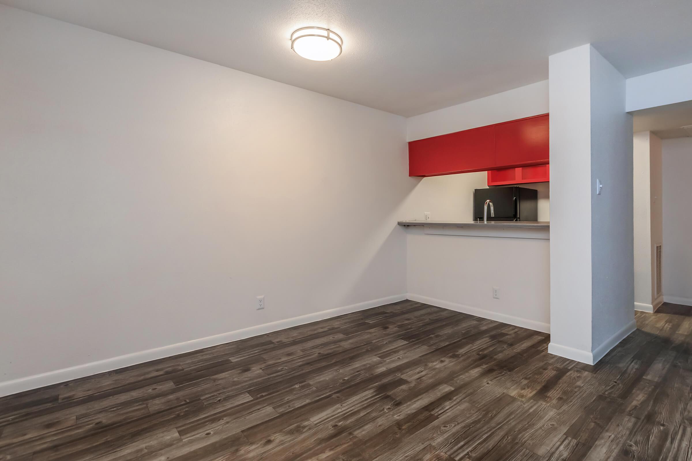 a kitchen with a wood floor