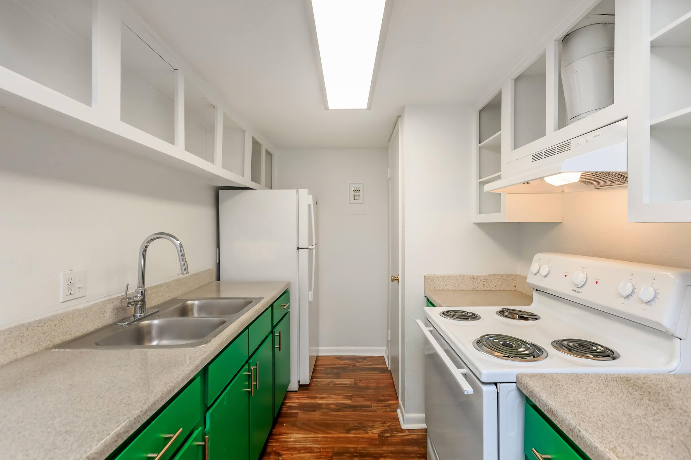 a kitchen with a stove and a sink