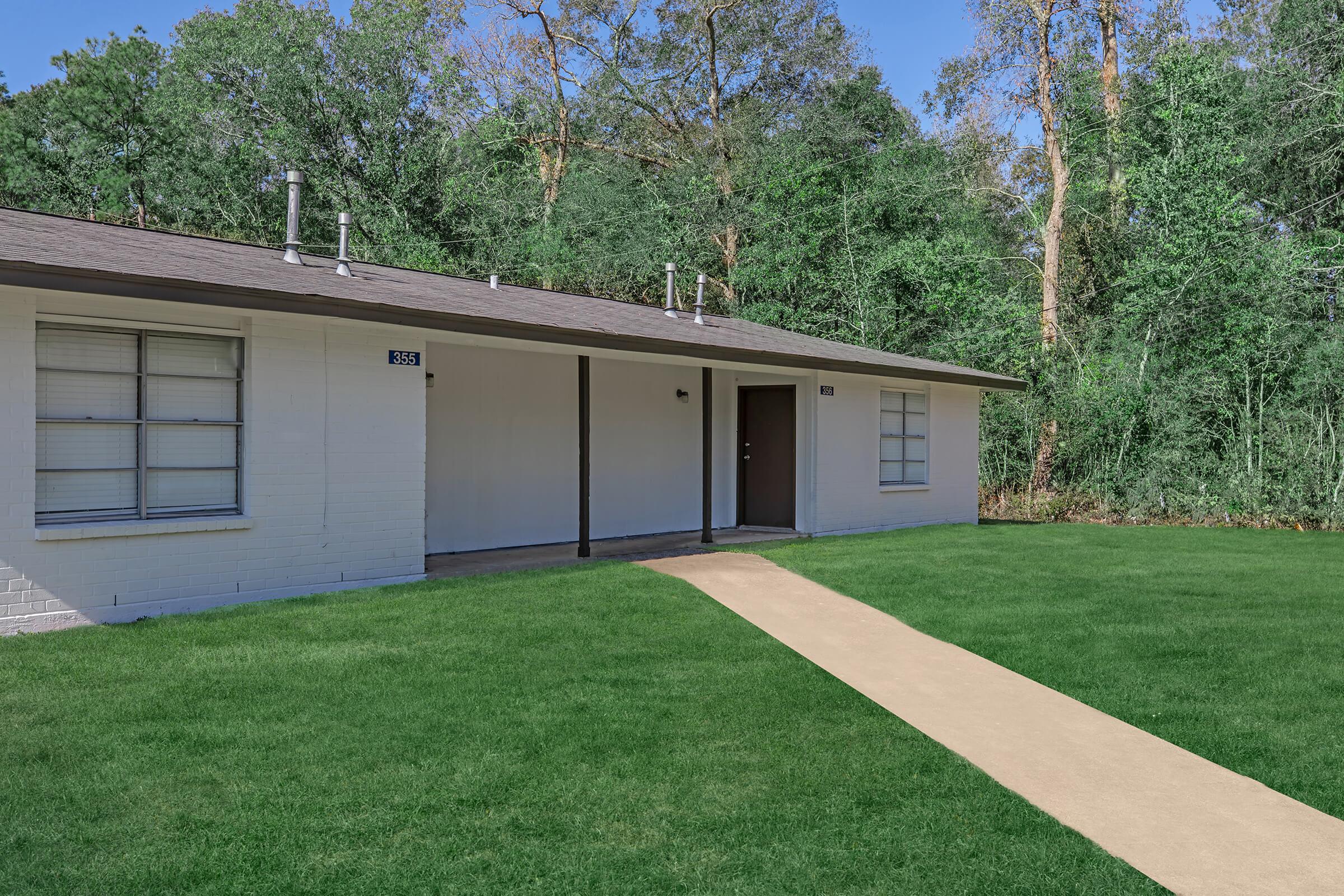 a large lawn in front of a house