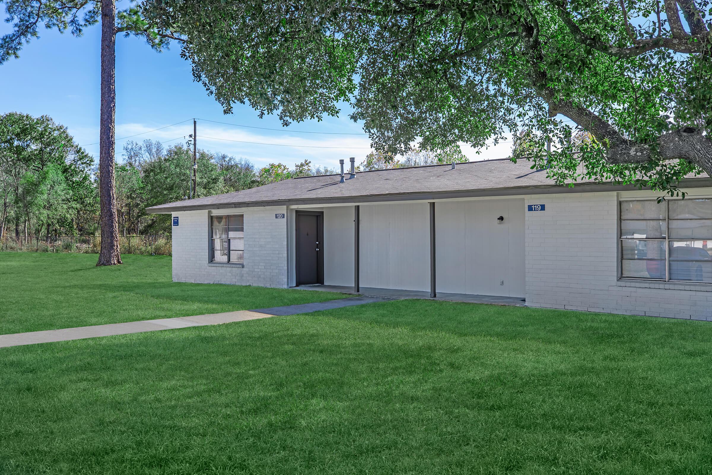 a large lawn in front of a house