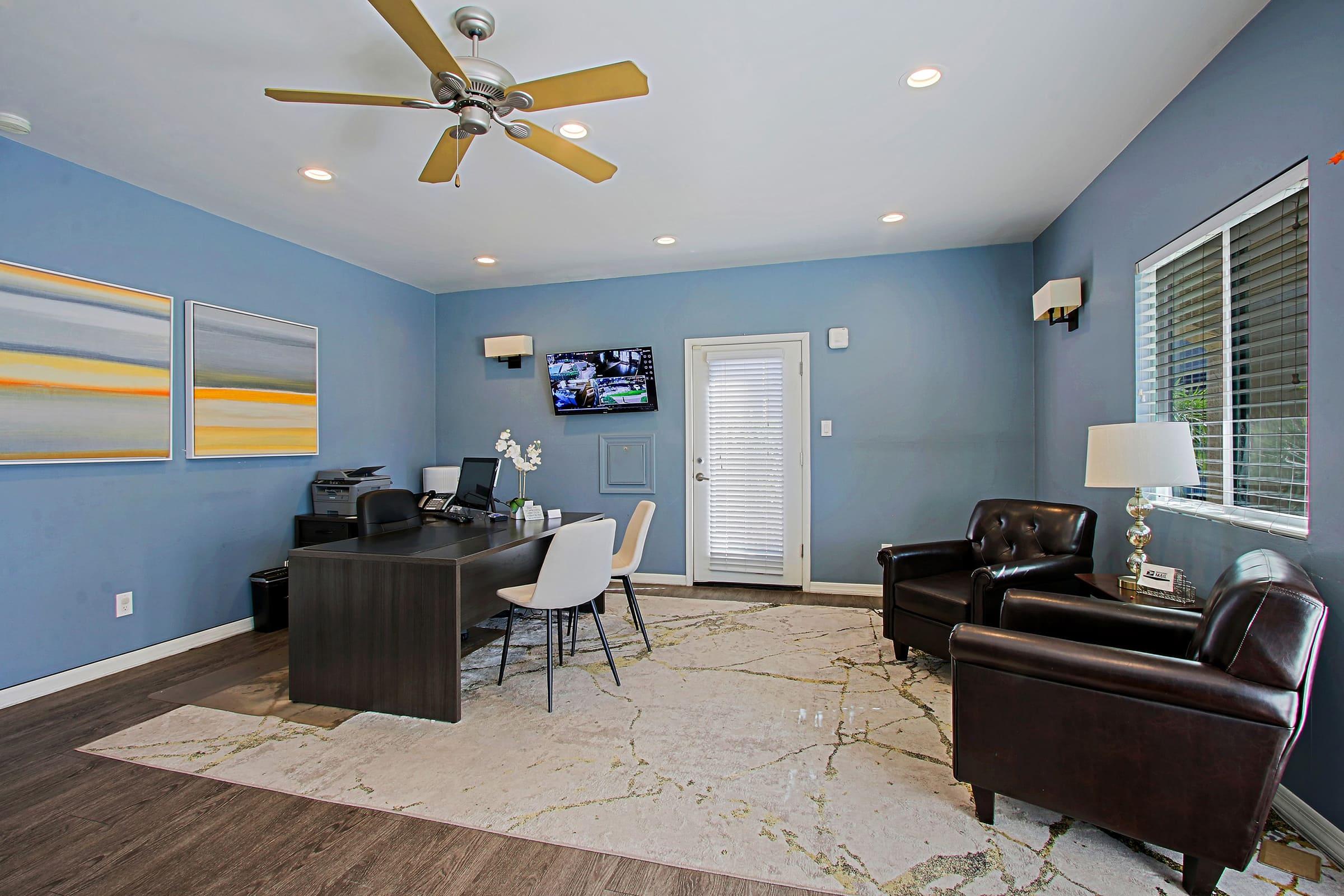 a living room filled with furniture and a large window