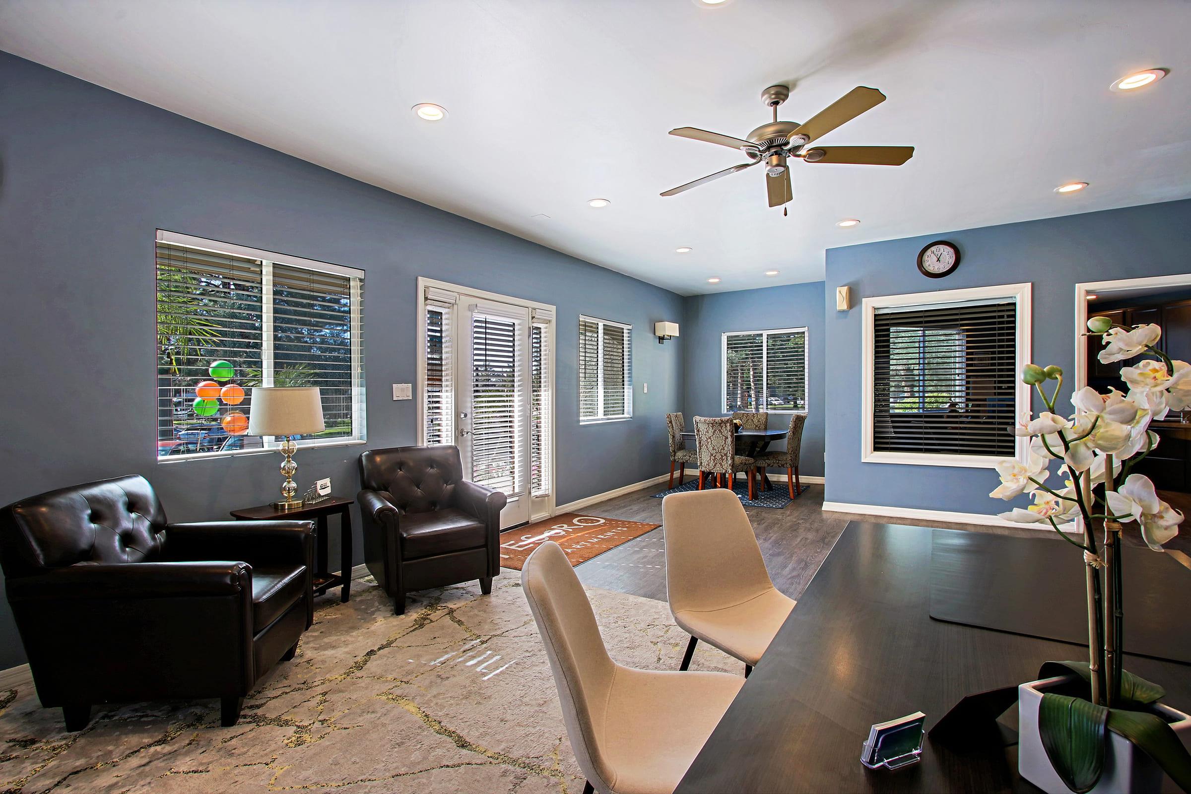 a living room filled with furniture and a large window