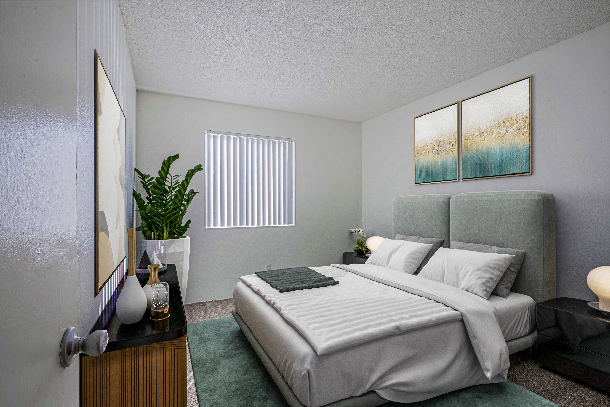 A modern bedroom featuring a bed with a gray headboard, white bedding, and decorative pillows. There's a nightstand with a lamp and decorative items. A potted plant adds greenery, while two abstract paintings hang on the wall. The room has a window with vertical blinds and a soft rug on the floor.