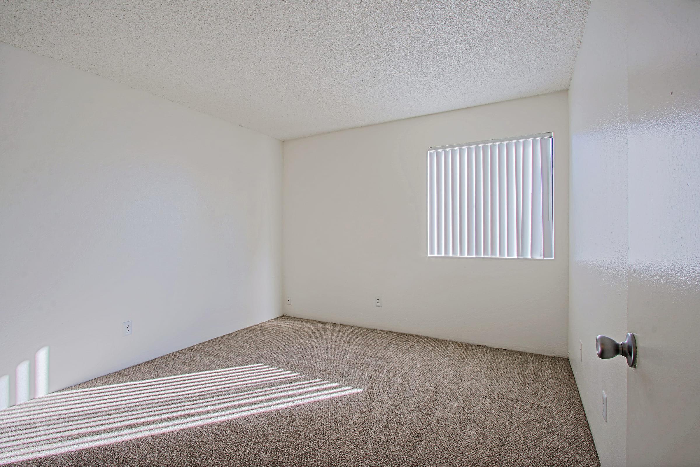 a bedroom with a bed and a mirror