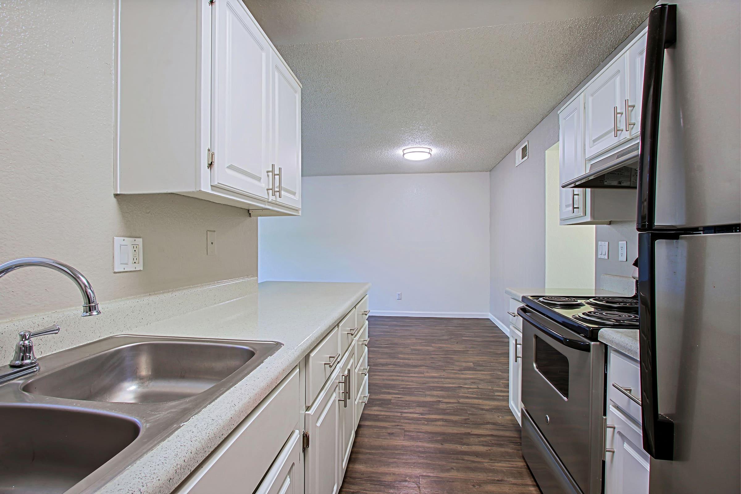 a kitchen with a stove and a sink