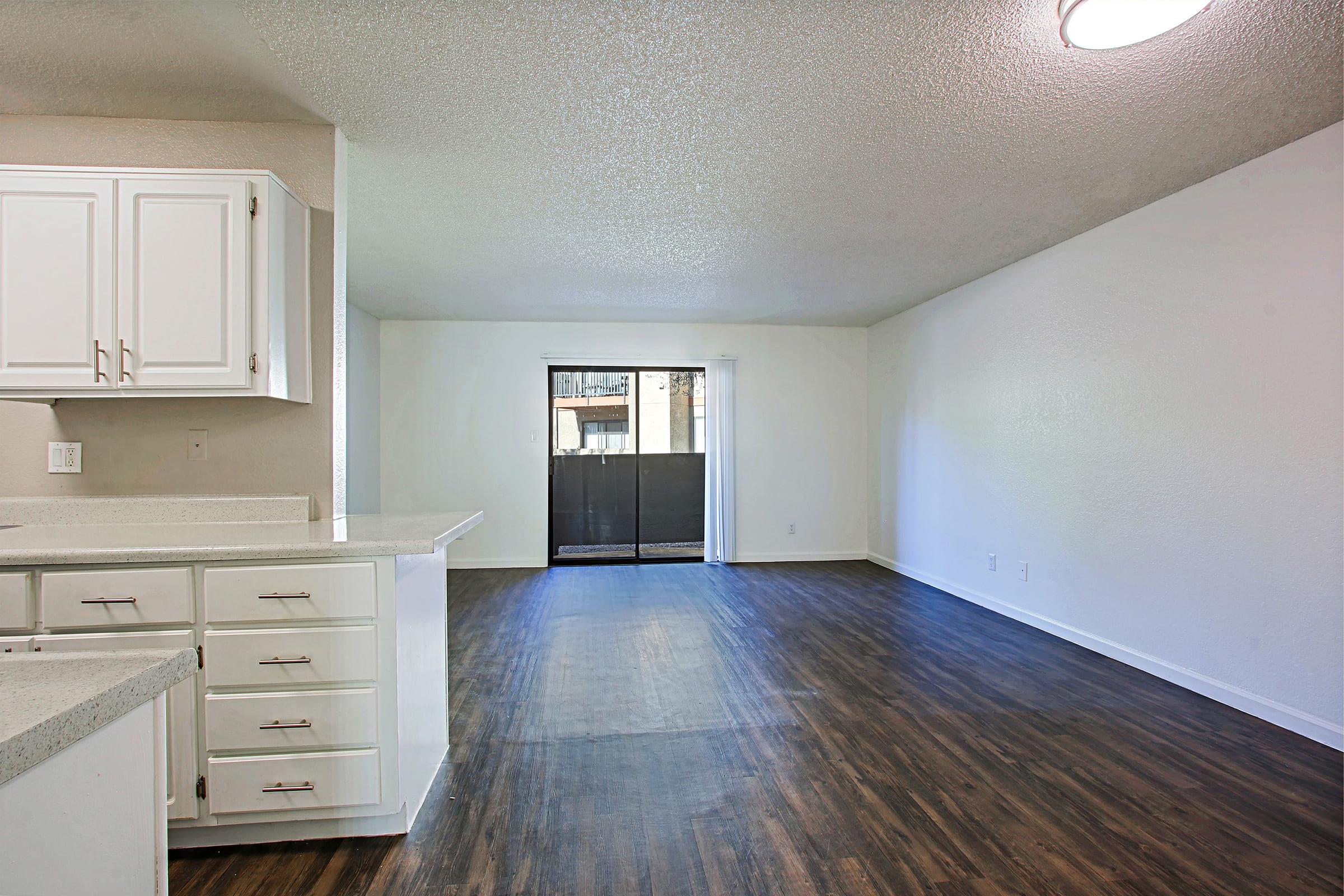 a kitchen with a wooden floor