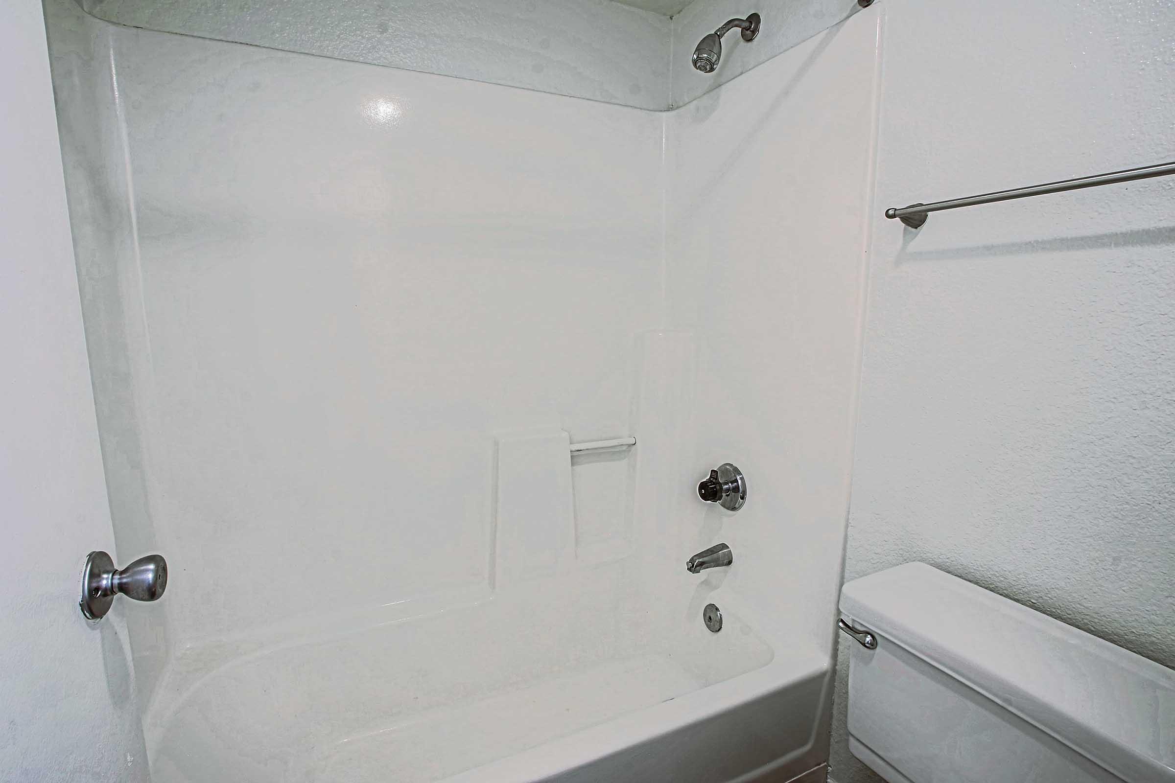 a room with a sink and a shower