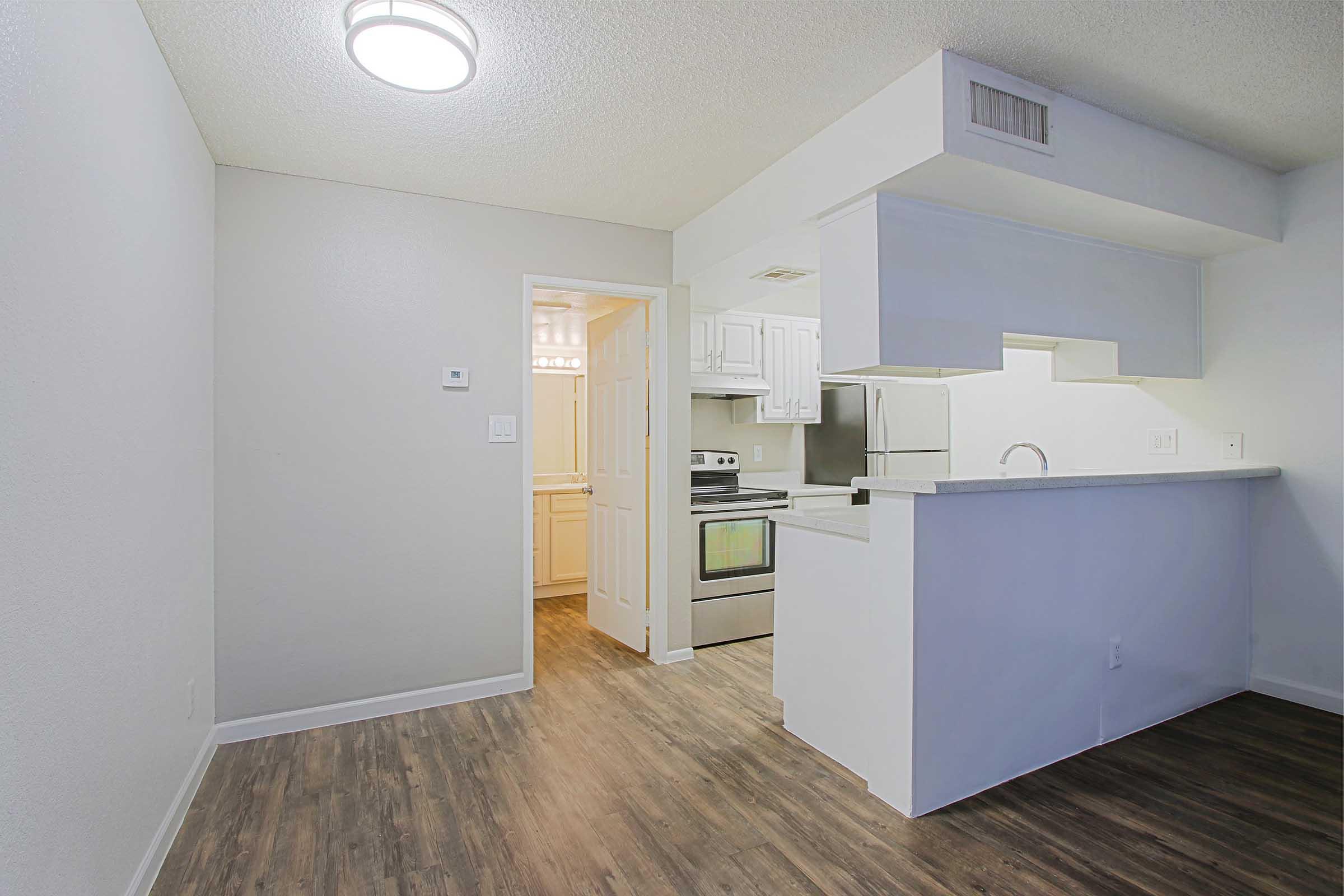 a kitchen with a sink and a refrigerator