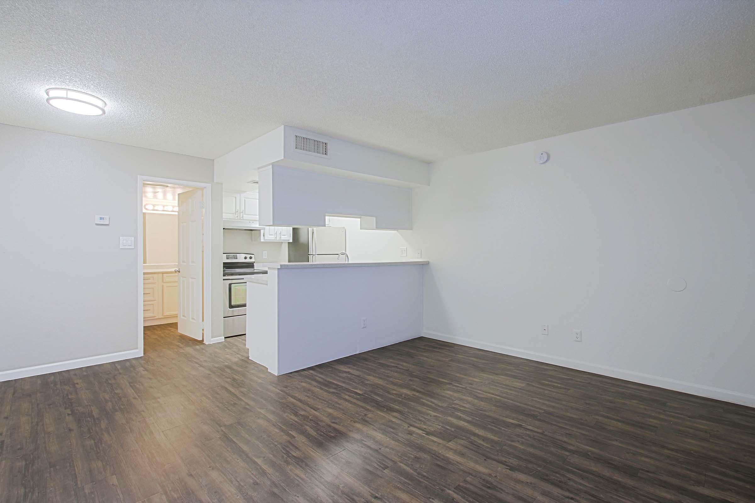 a kitchen with a wooden floor