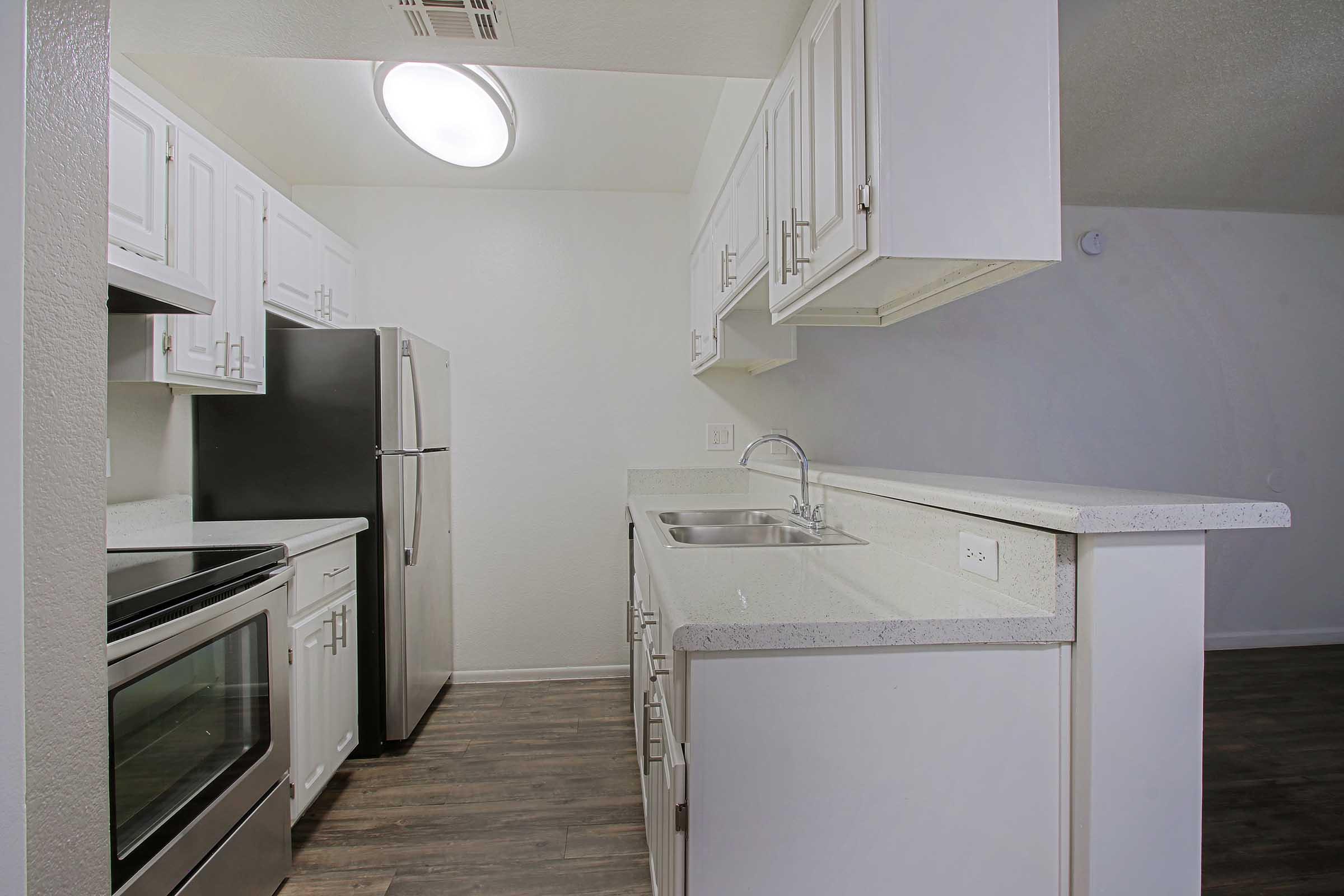 a kitchen with a stove top oven sitting inside of a refrigerator