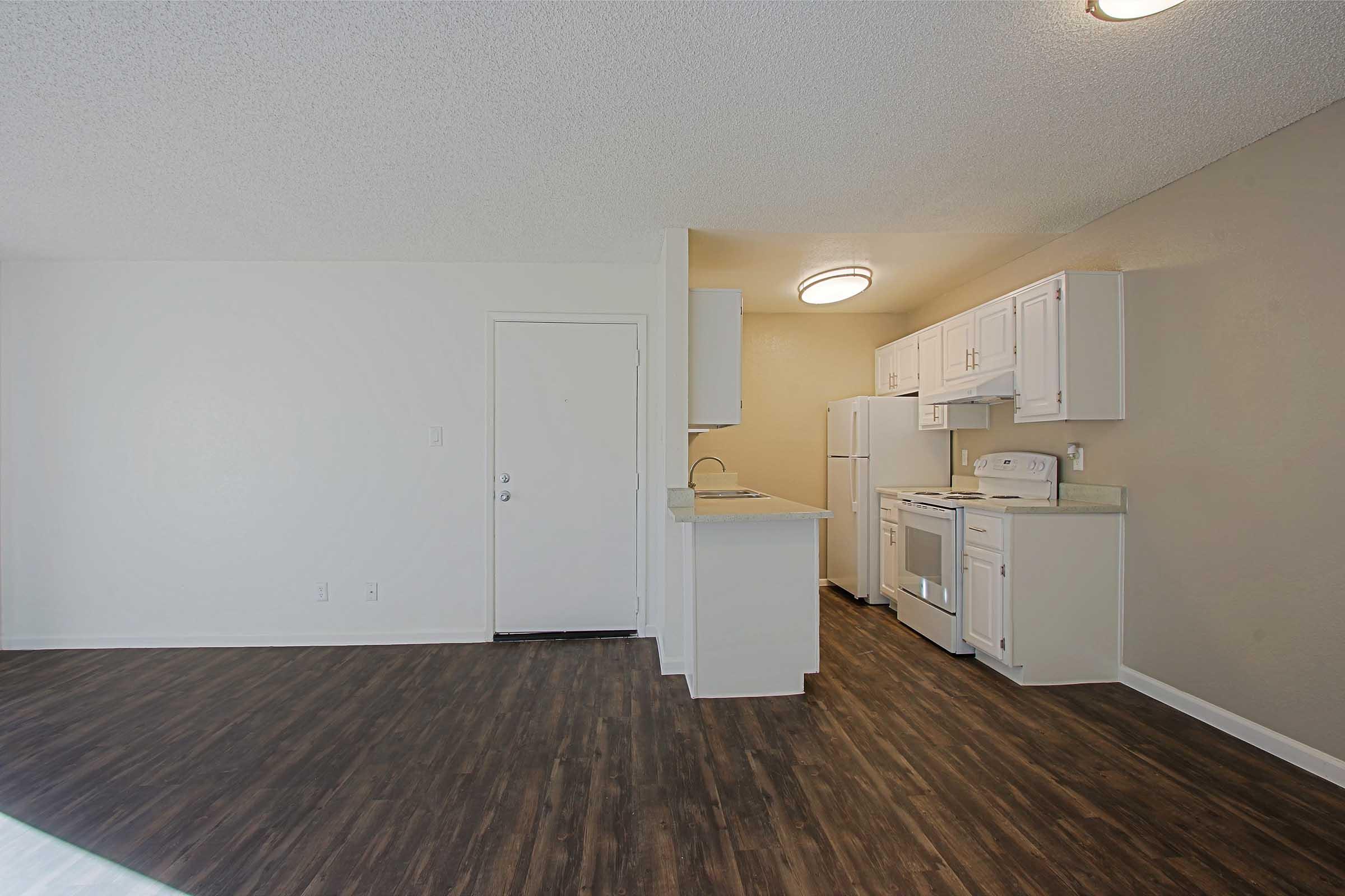 a kitchen with a wooden floor