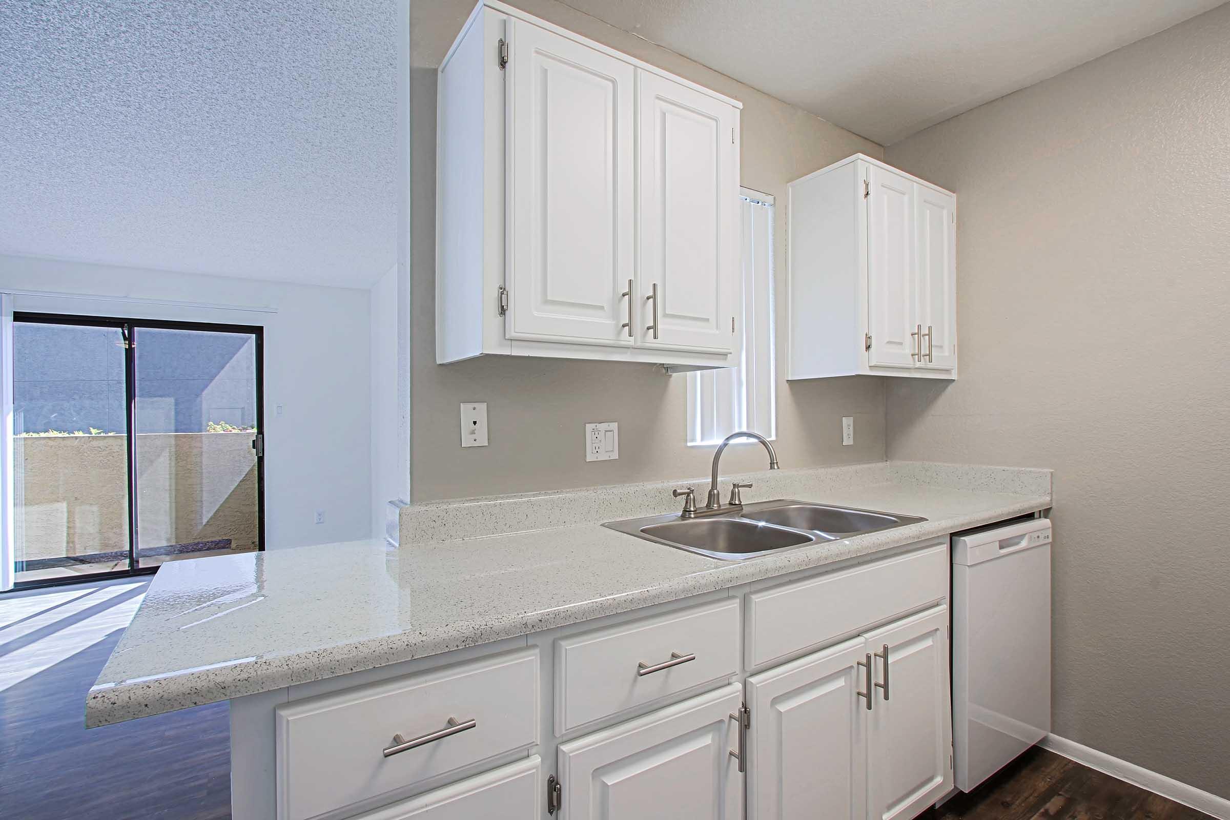 a kitchen with a sink and a microwave