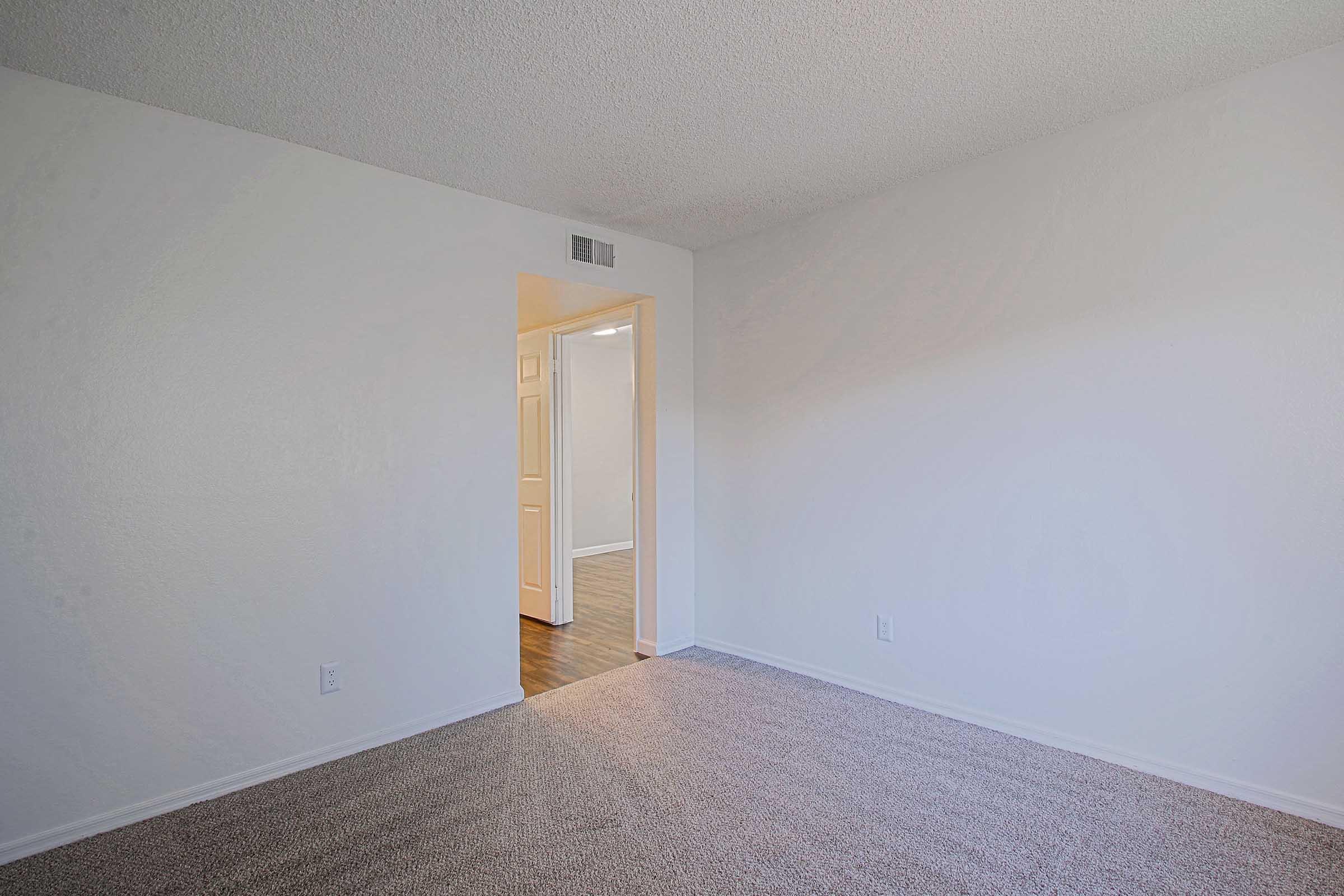 a bedroom with a large mirror