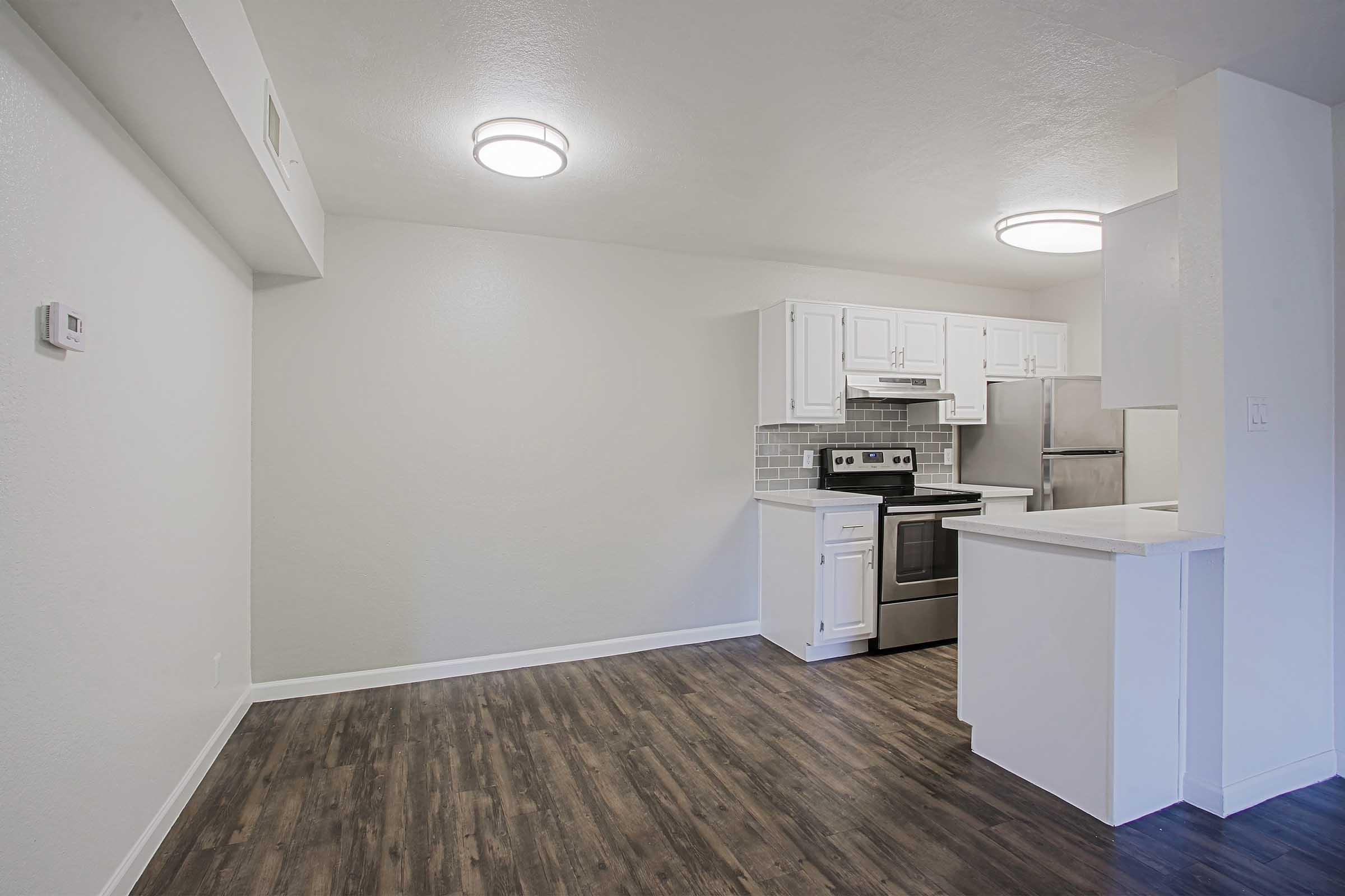 a kitchen with a wooden floor