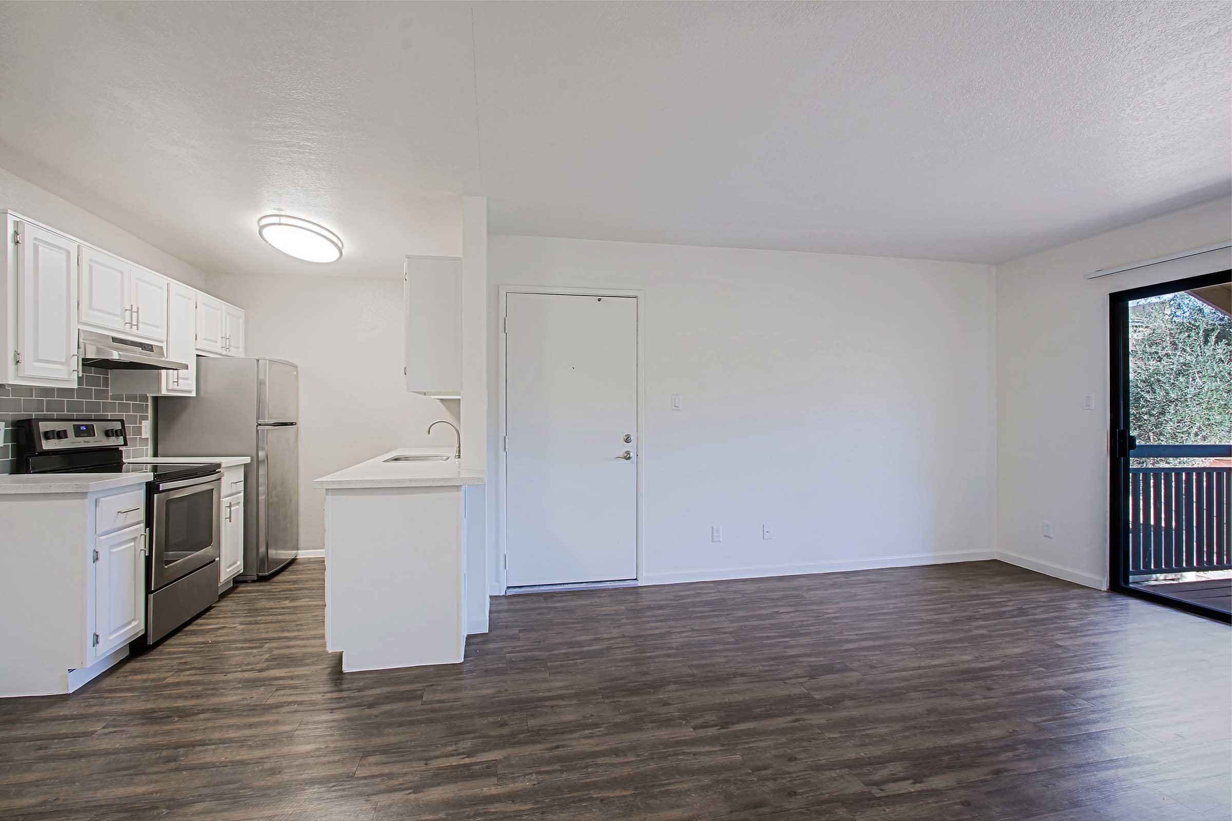 a kitchen with a wooden floor