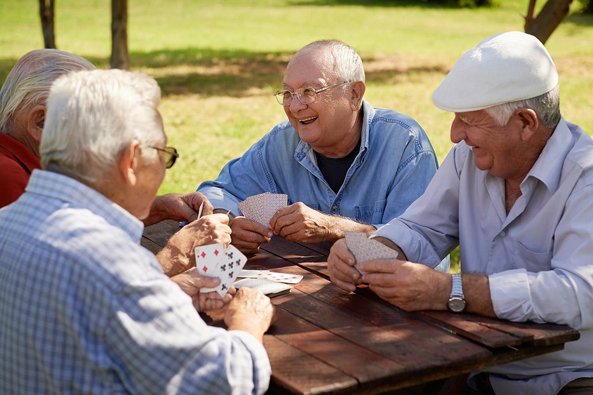 a group of people sitting at a picnic table
