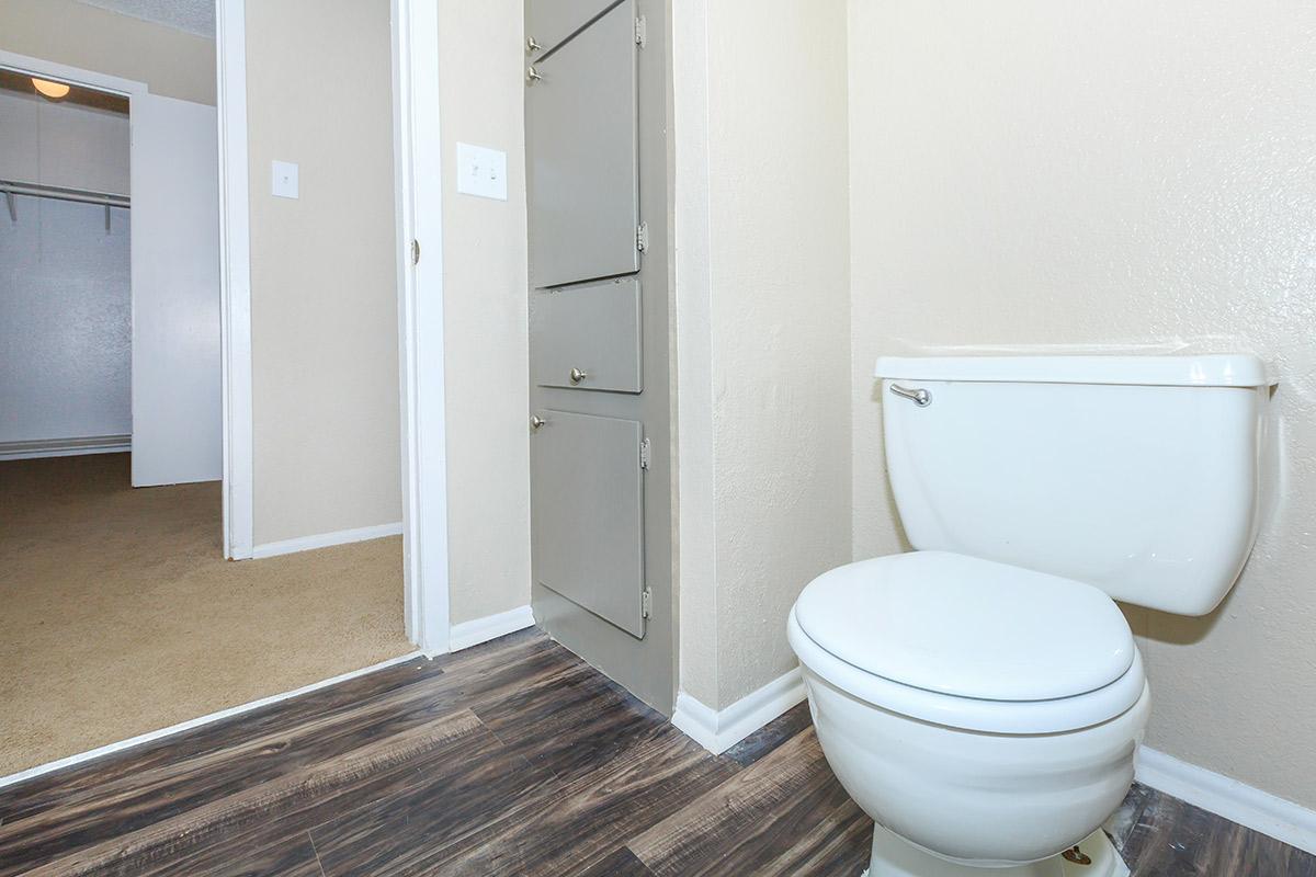 a white sink sitting next to a door