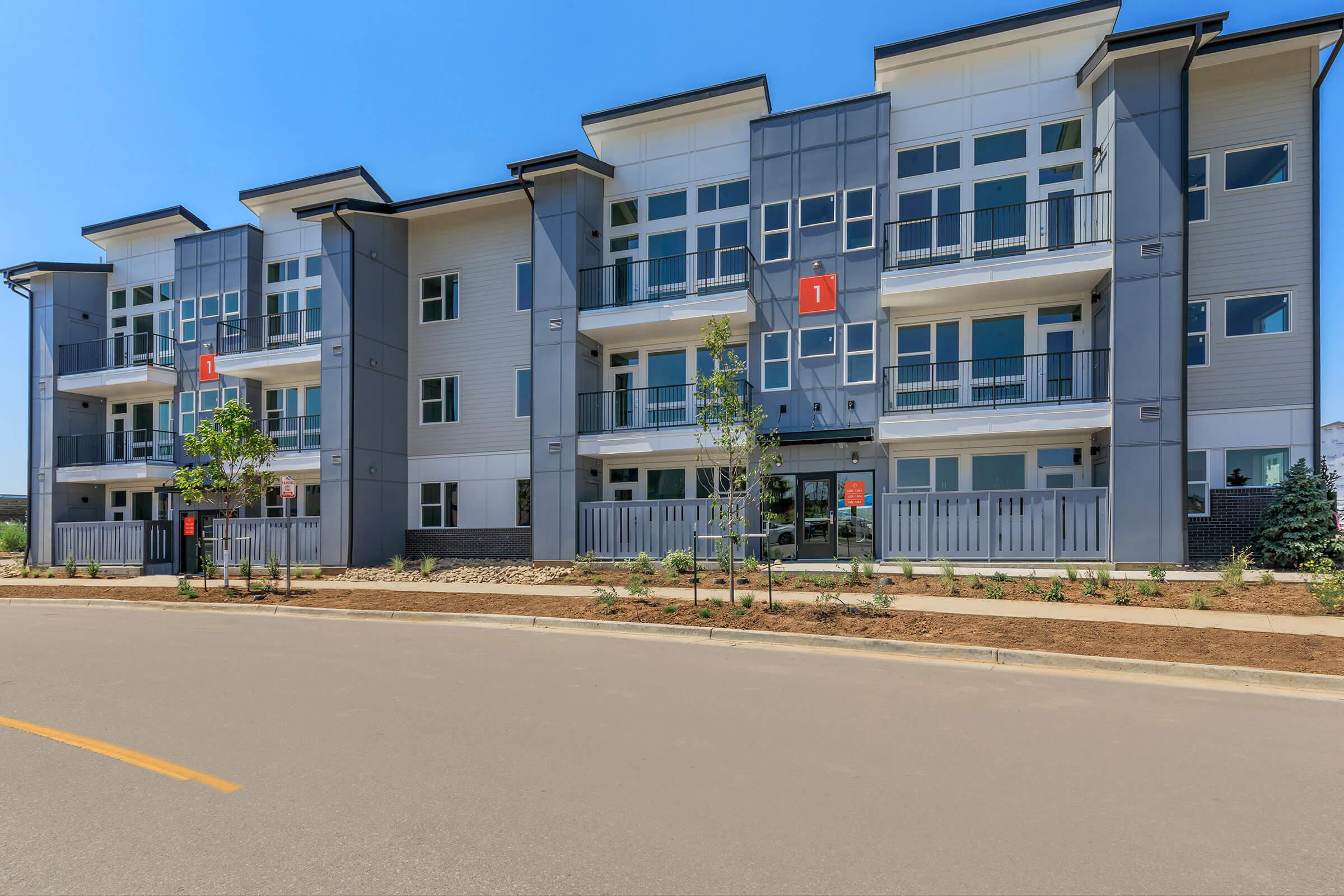 an empty parking lot in front of a building