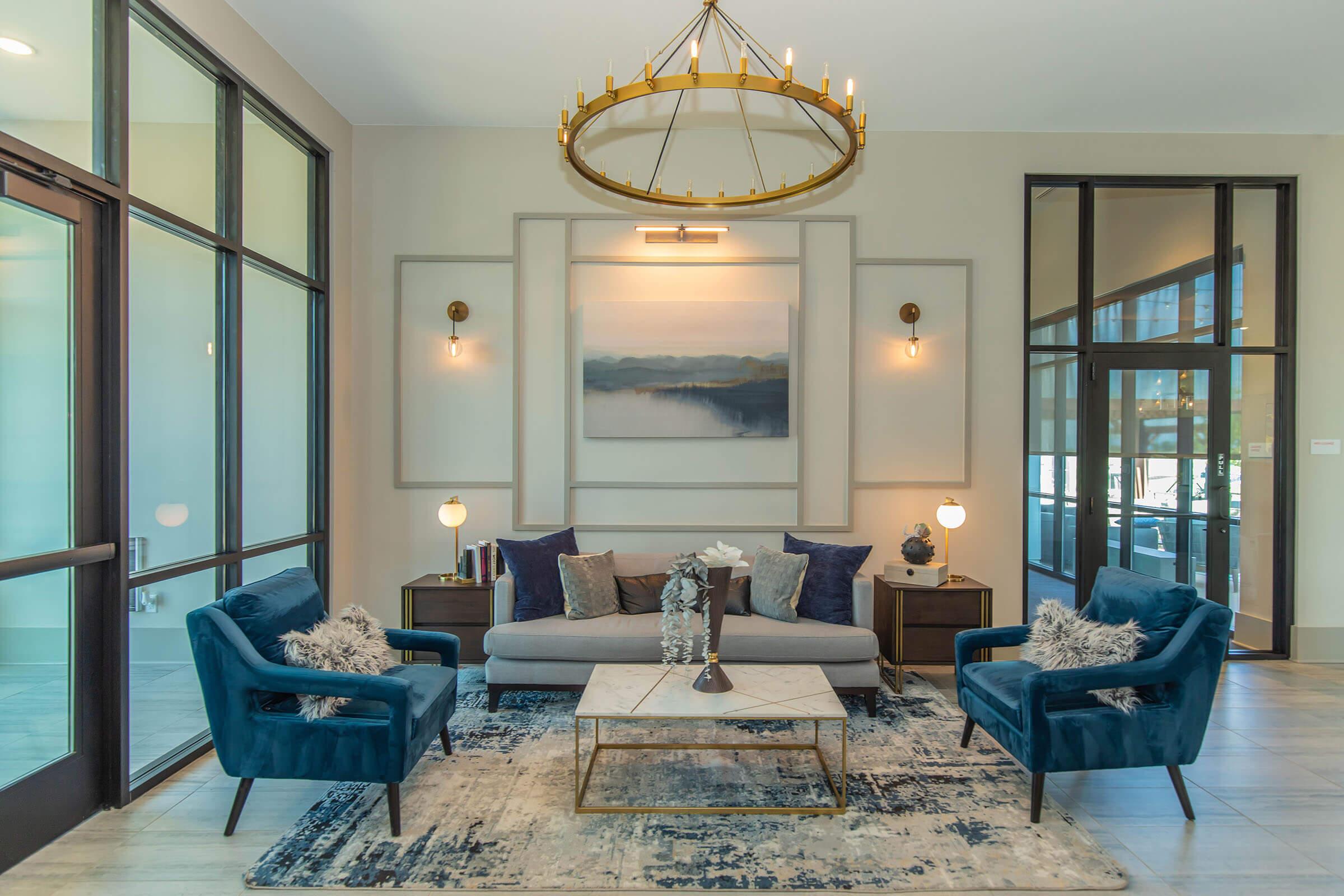 a living room filled with furniture and a large window