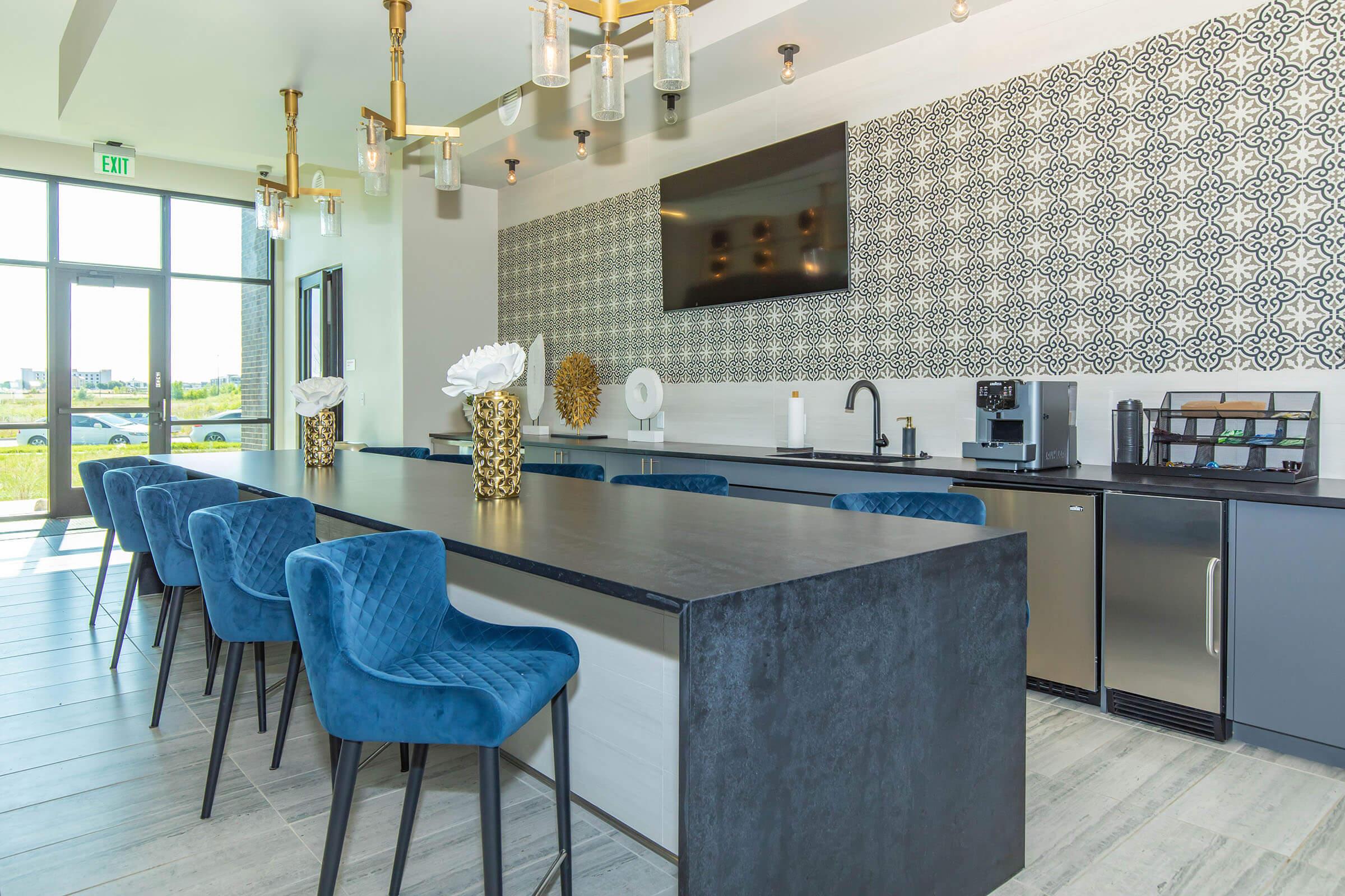 a kitchen with a blue chair