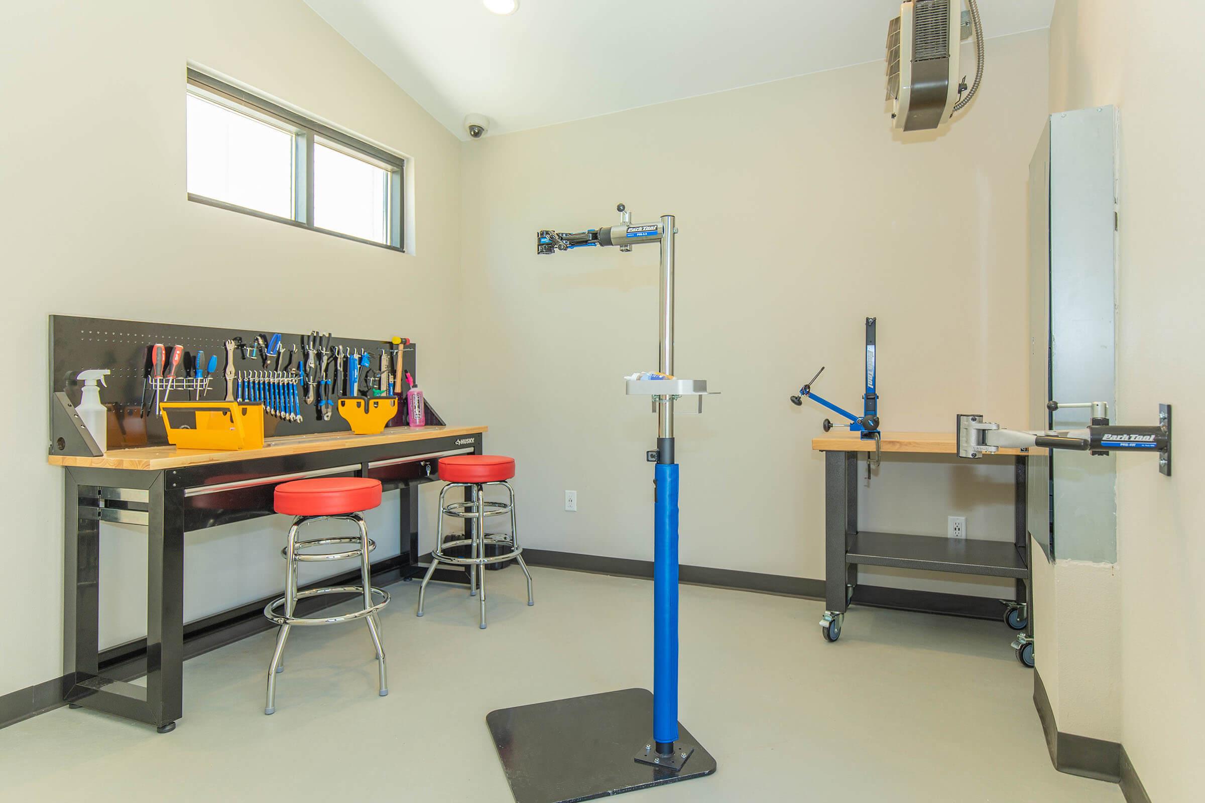 an office with a desk and chair in a room