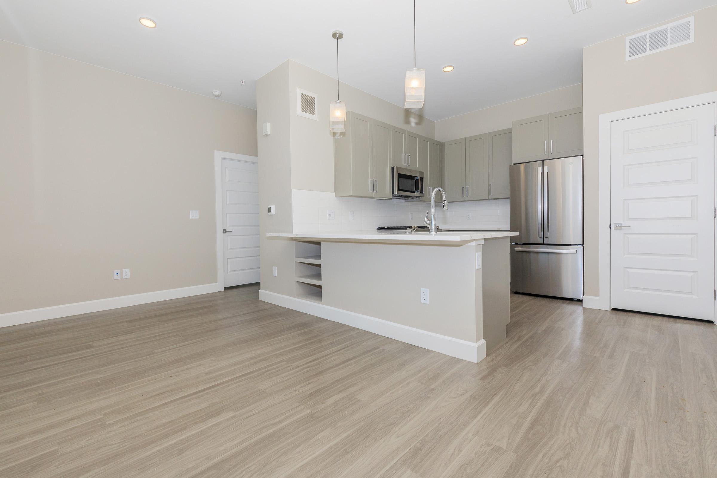 a kitchen with a wooden floor