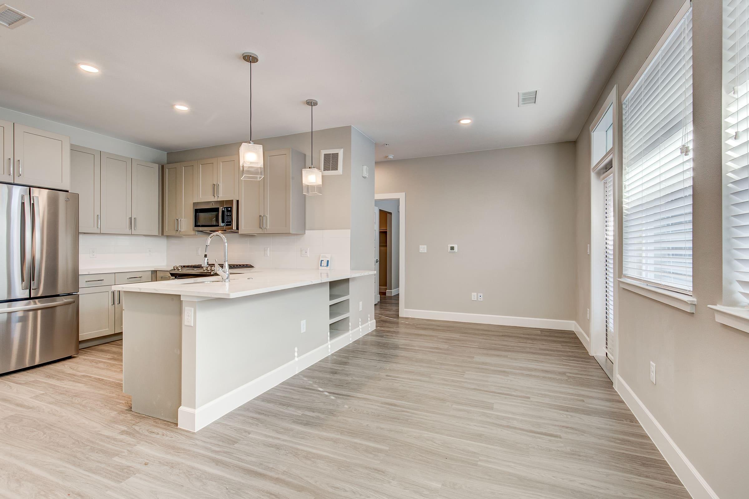 a kitchen with a wooden floor