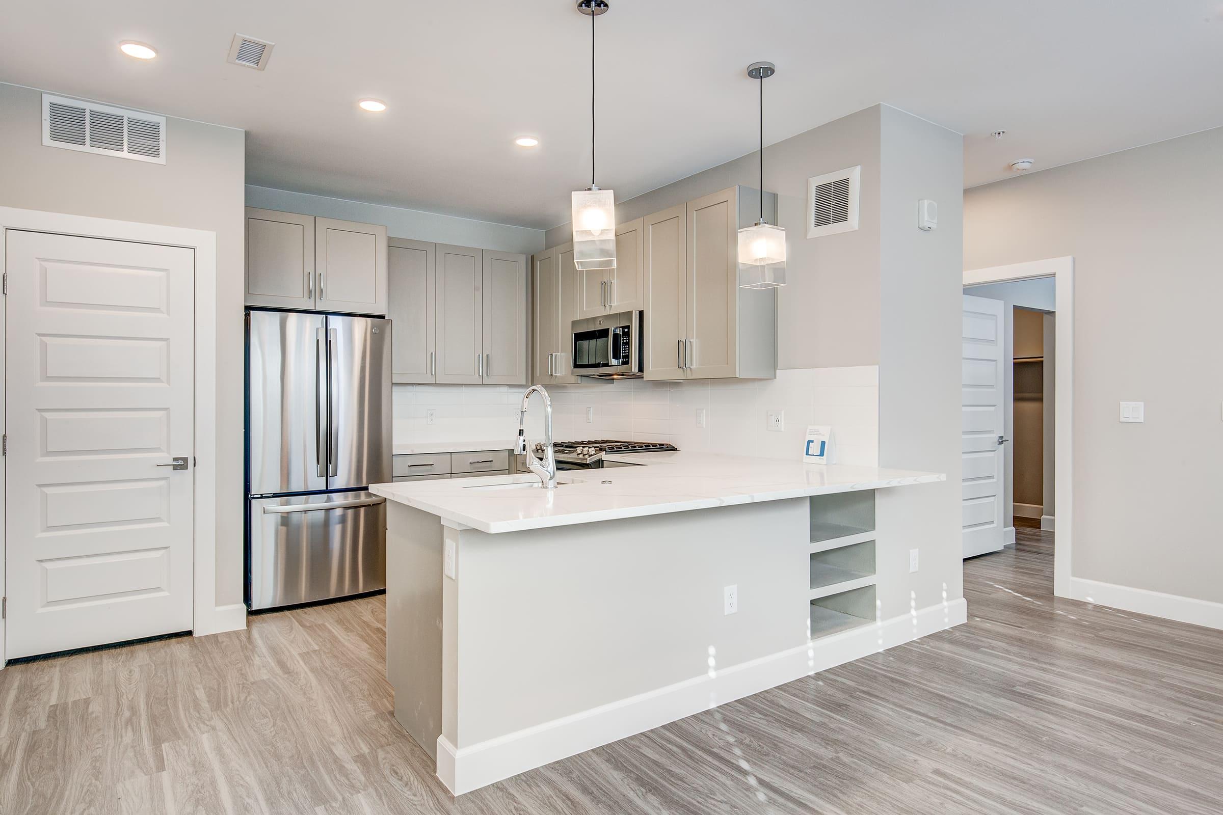 a kitchen with a wood floor