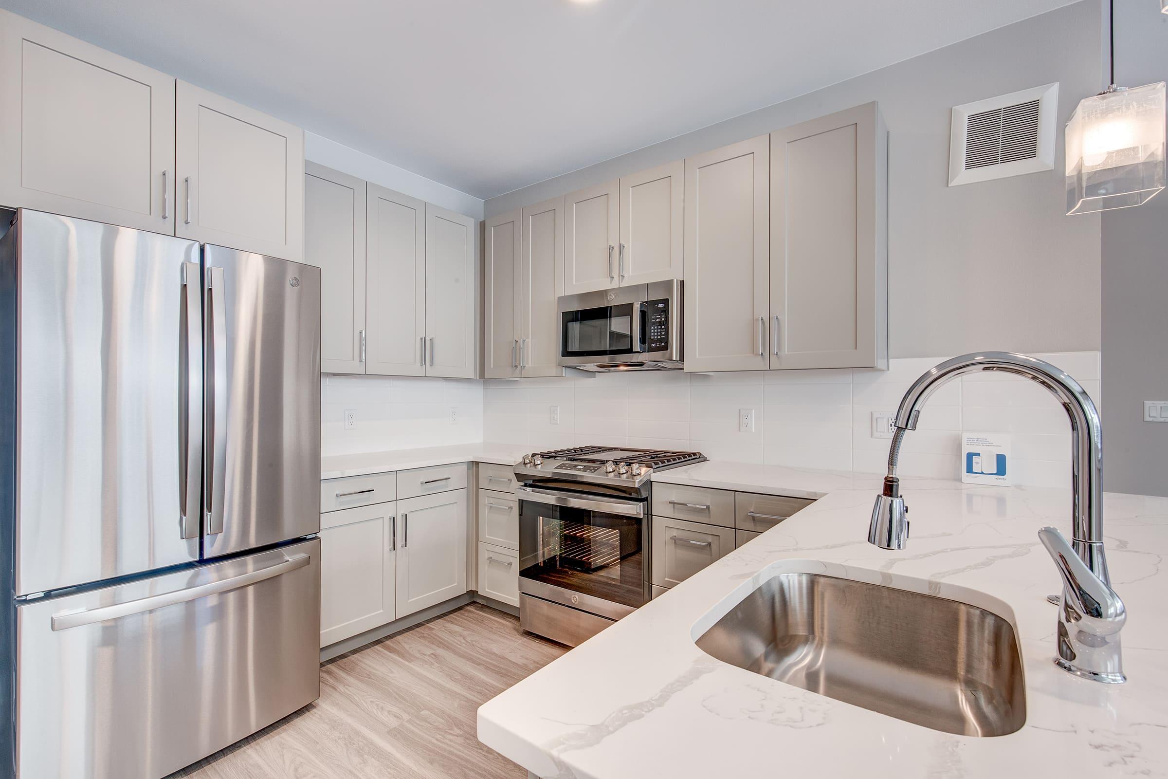 a kitchen with a sink and a microwave