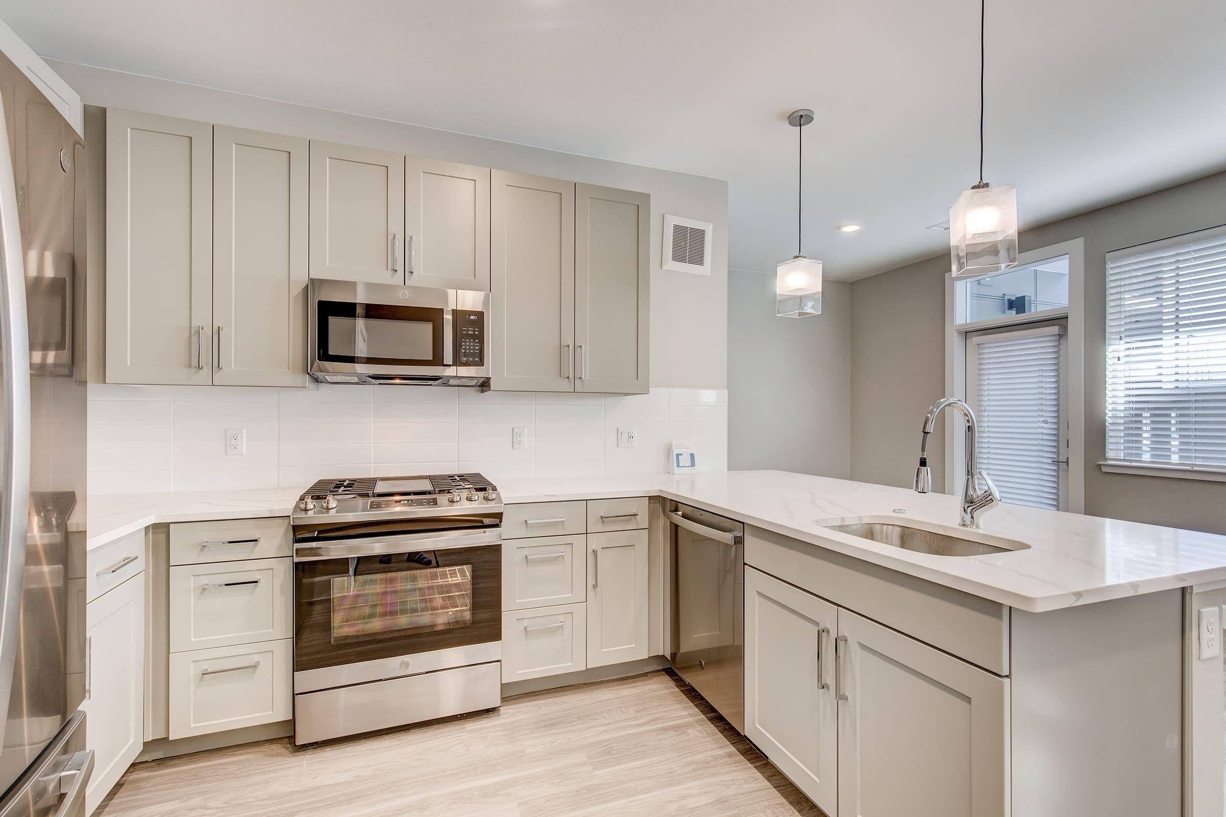 a kitchen with a sink and a microwave