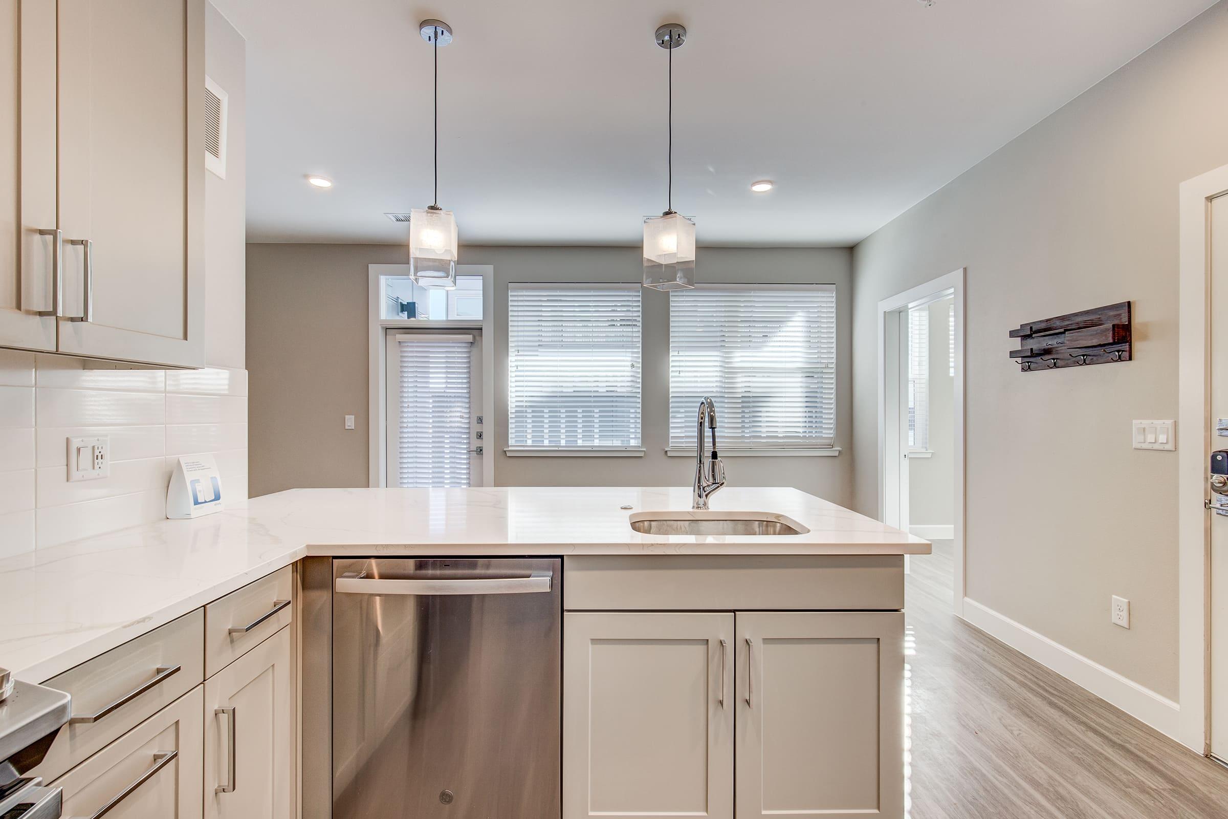 a kitchen with a sink and a window