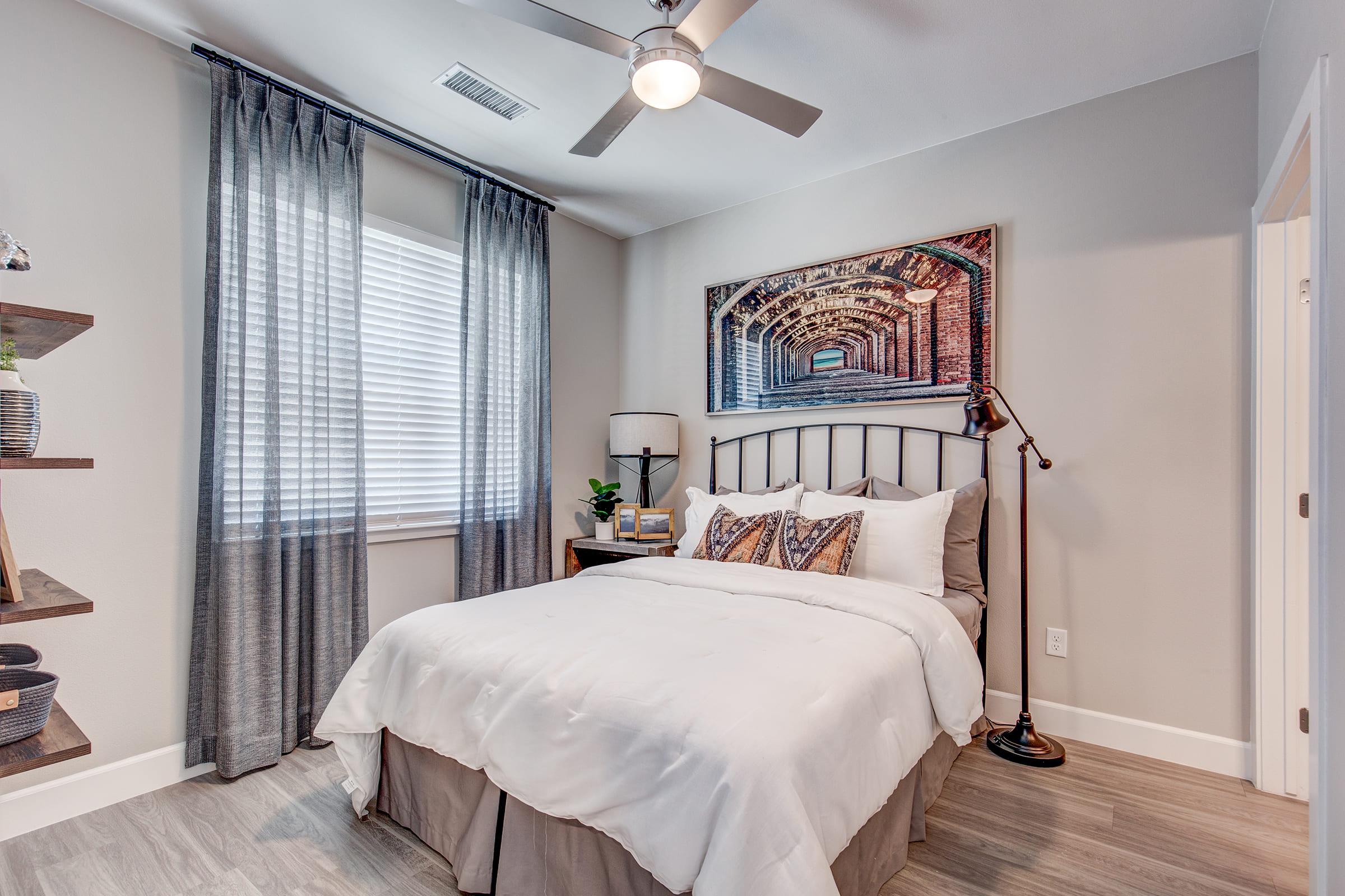 a bedroom with a large bed in a room