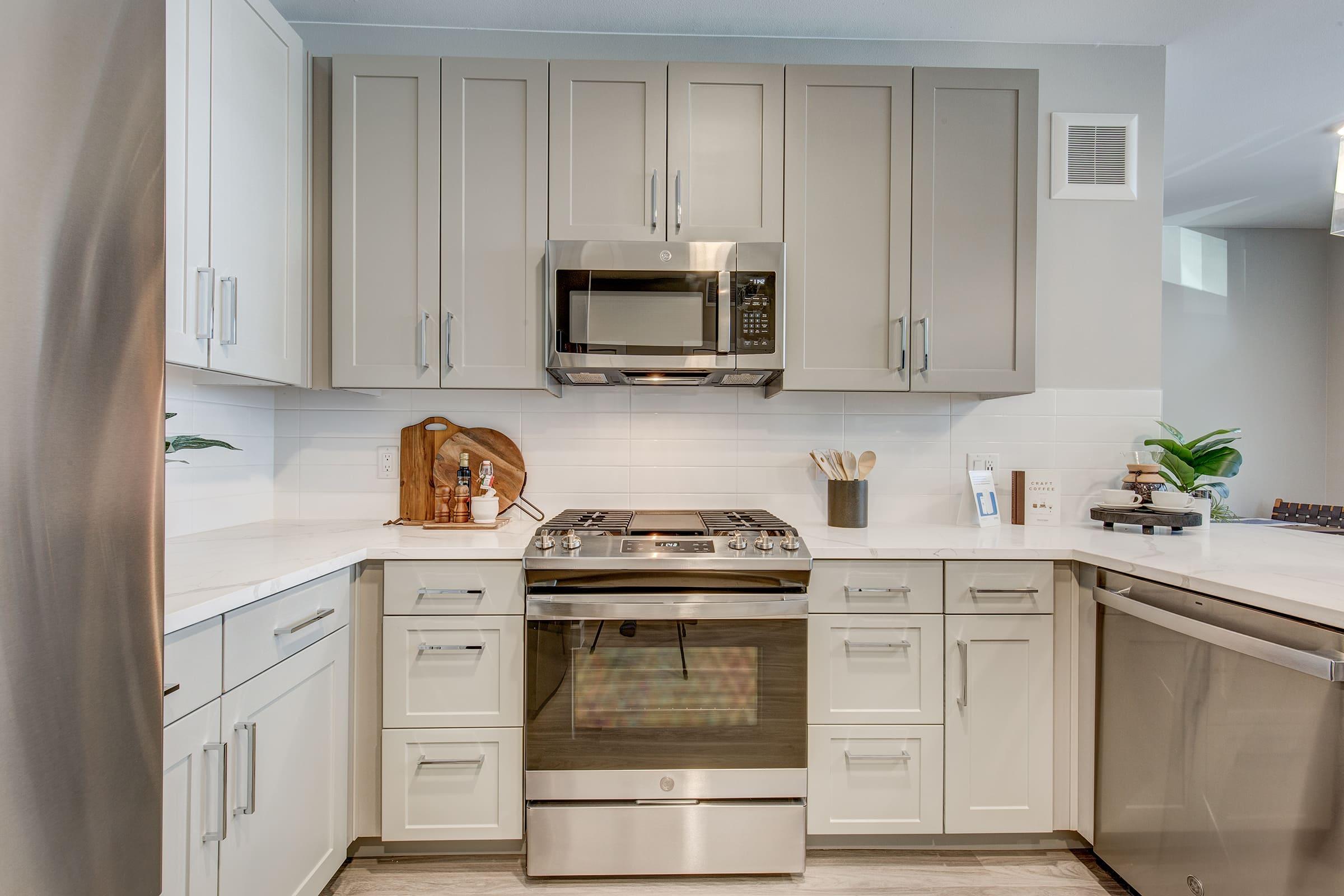 a kitchen with a stove and a refrigerator