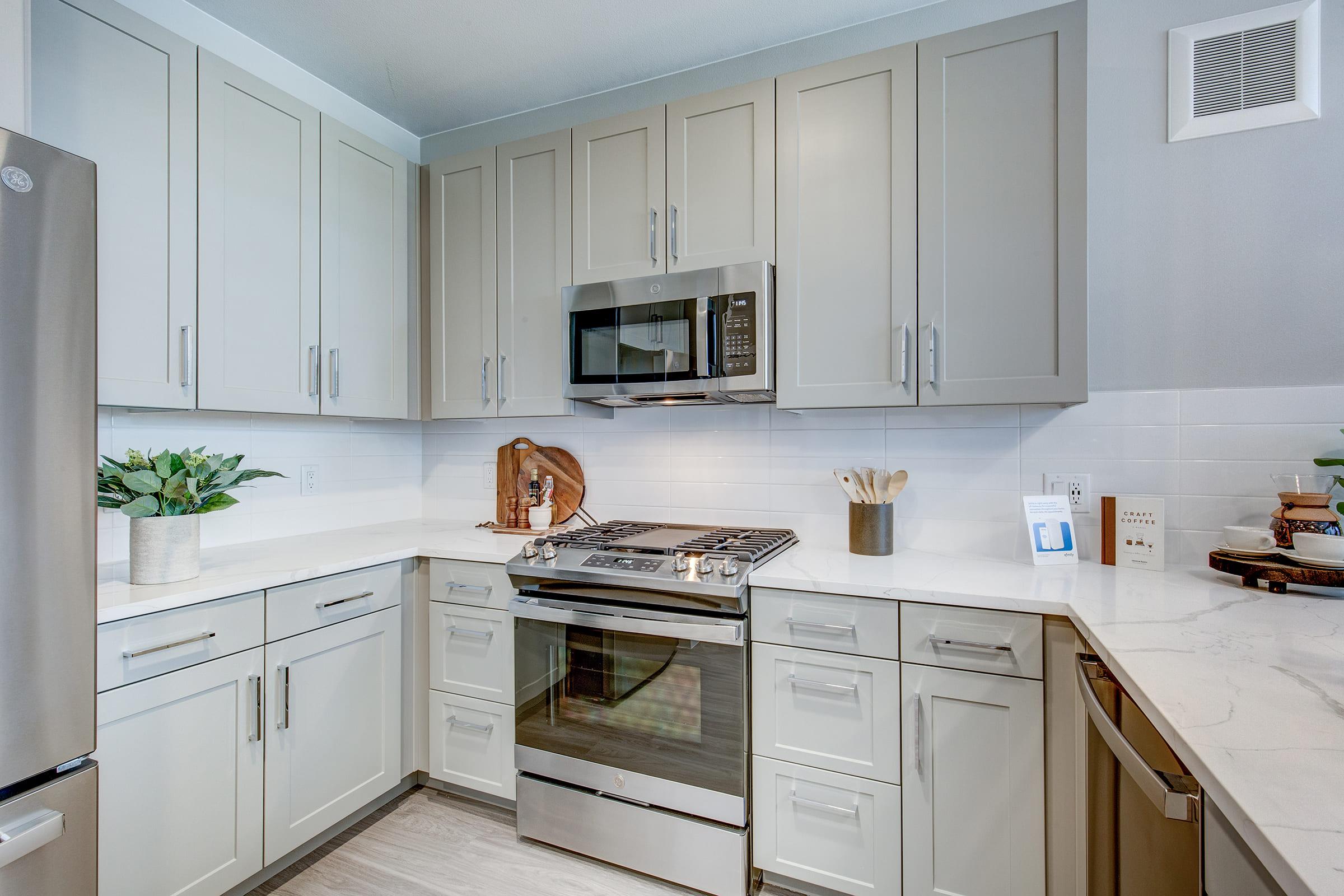 a kitchen with a sink and a microwave