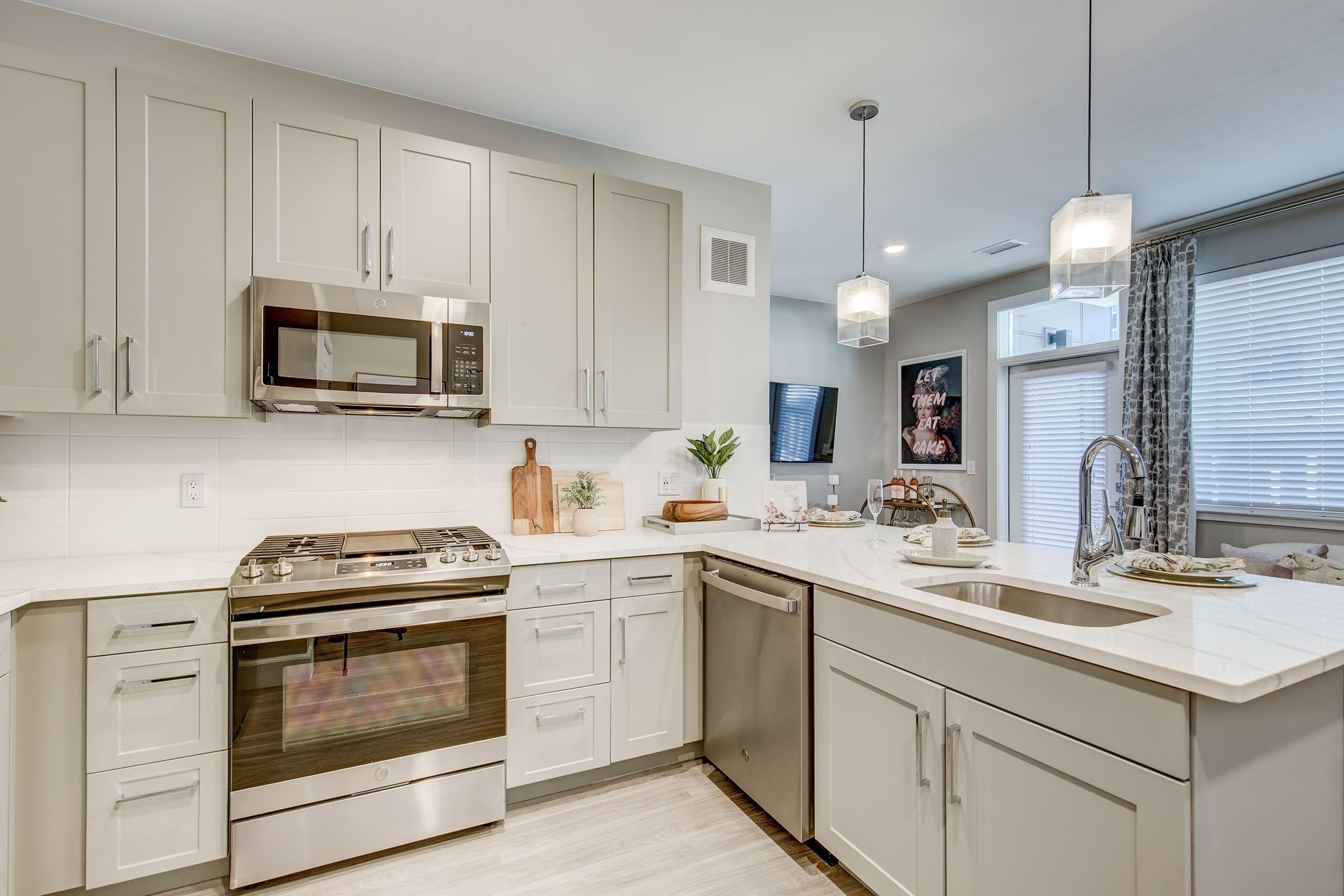 a kitchen with a sink and a microwave