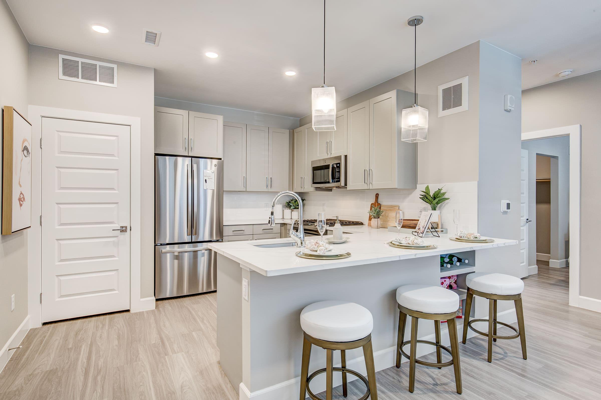 a kitchen with an island in the middle of a room