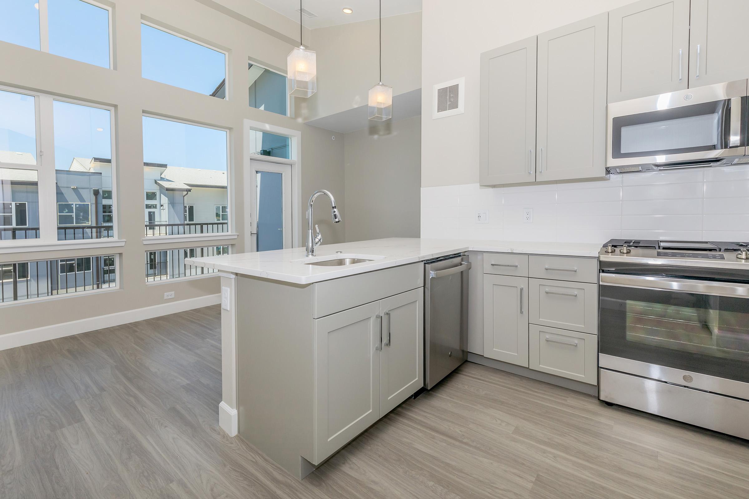 a kitchen with a large window