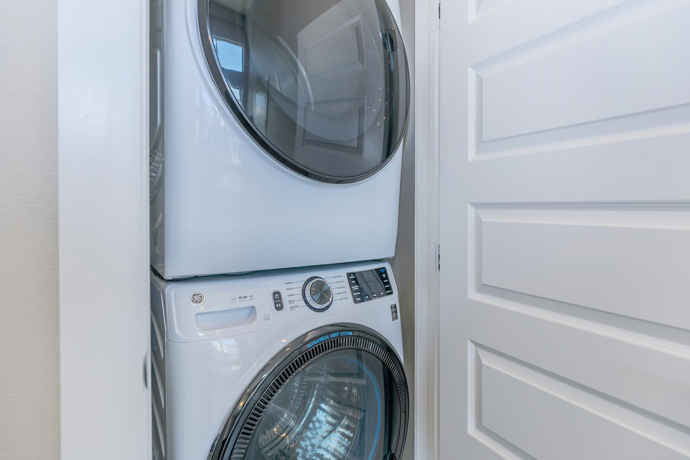 a microwave is sitting on a tiled floor