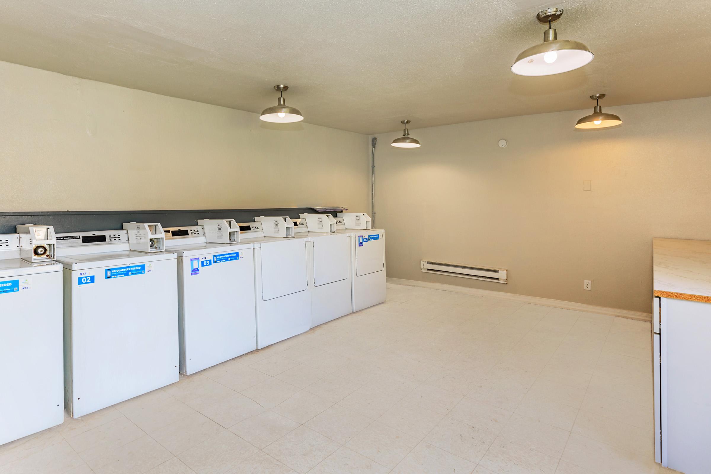 a kitchen with a sink and a refrigerator