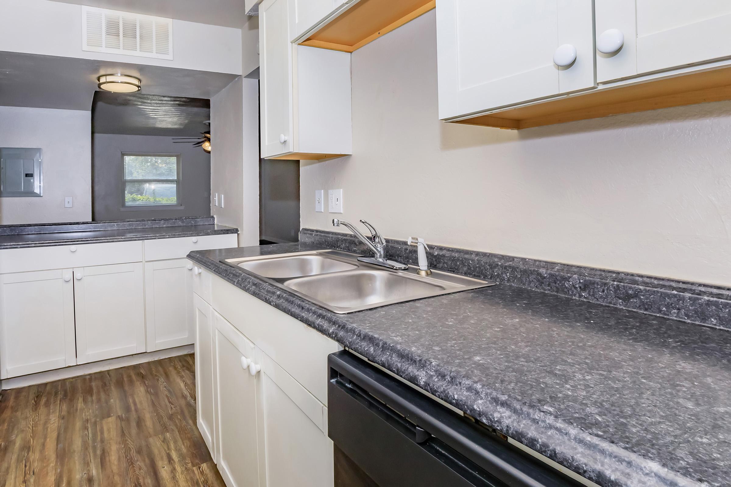 a kitchen with a stove and a sink