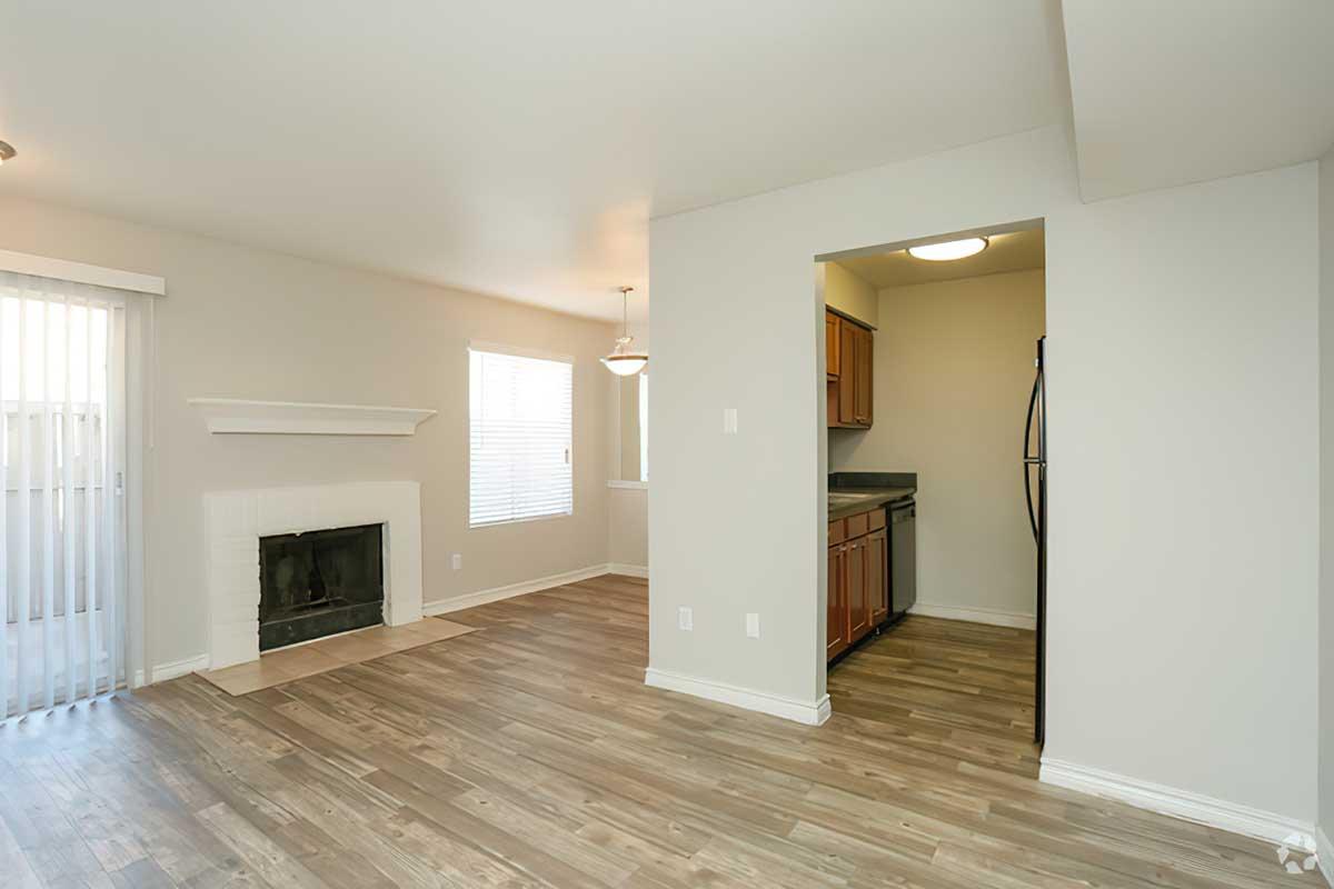 a large empty room with a wood floor