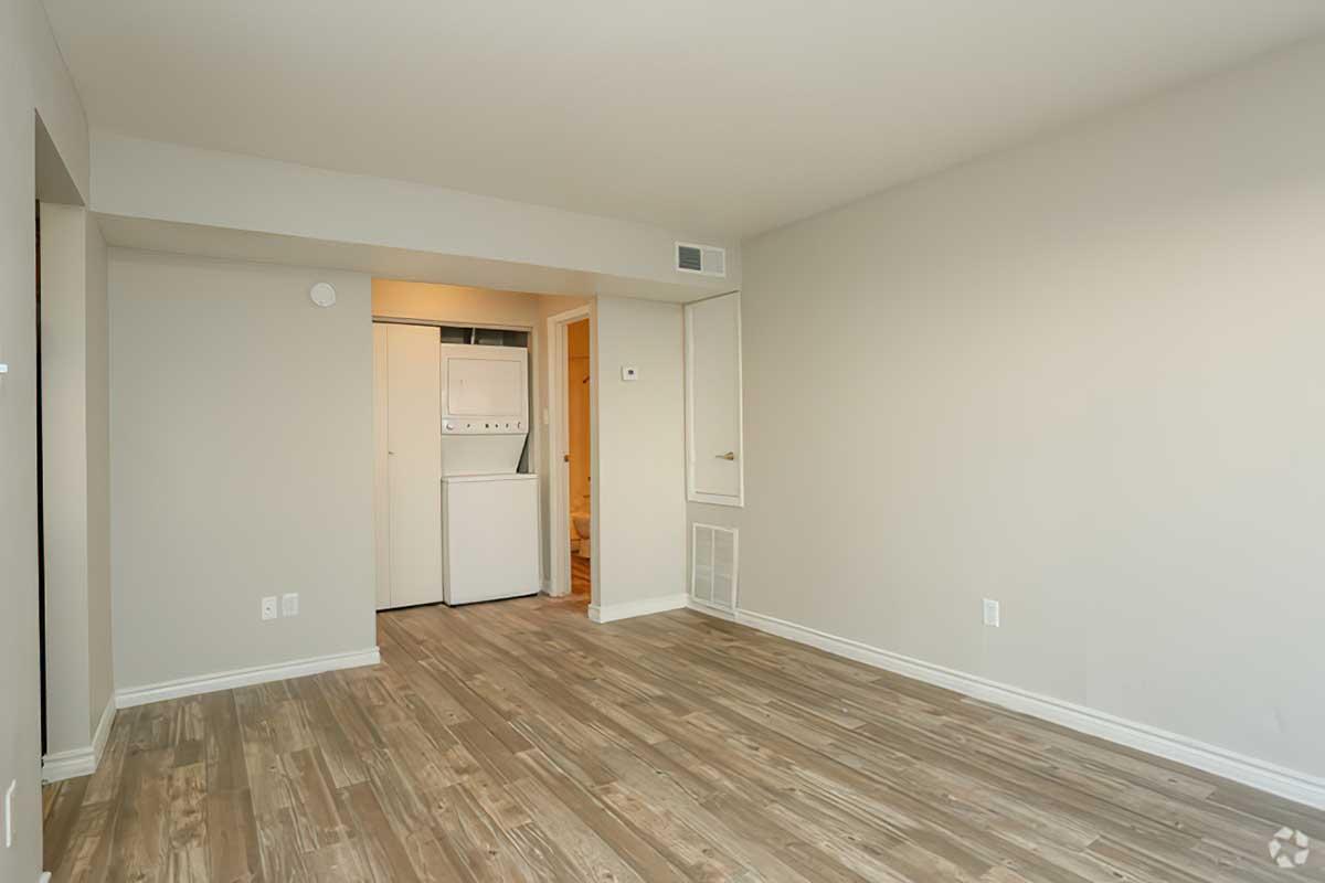 a large empty room with a wooden floor