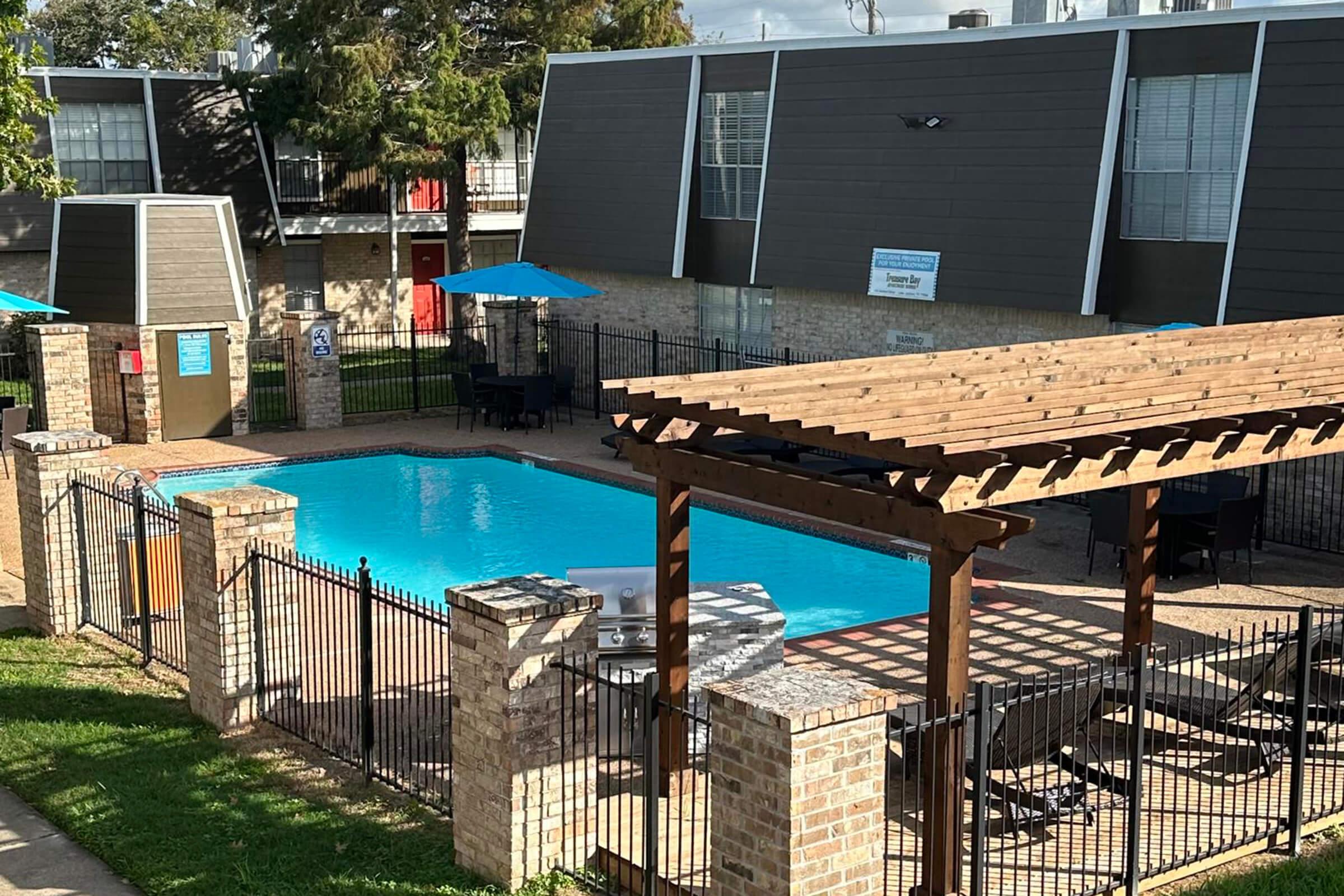 a pool next to a fence