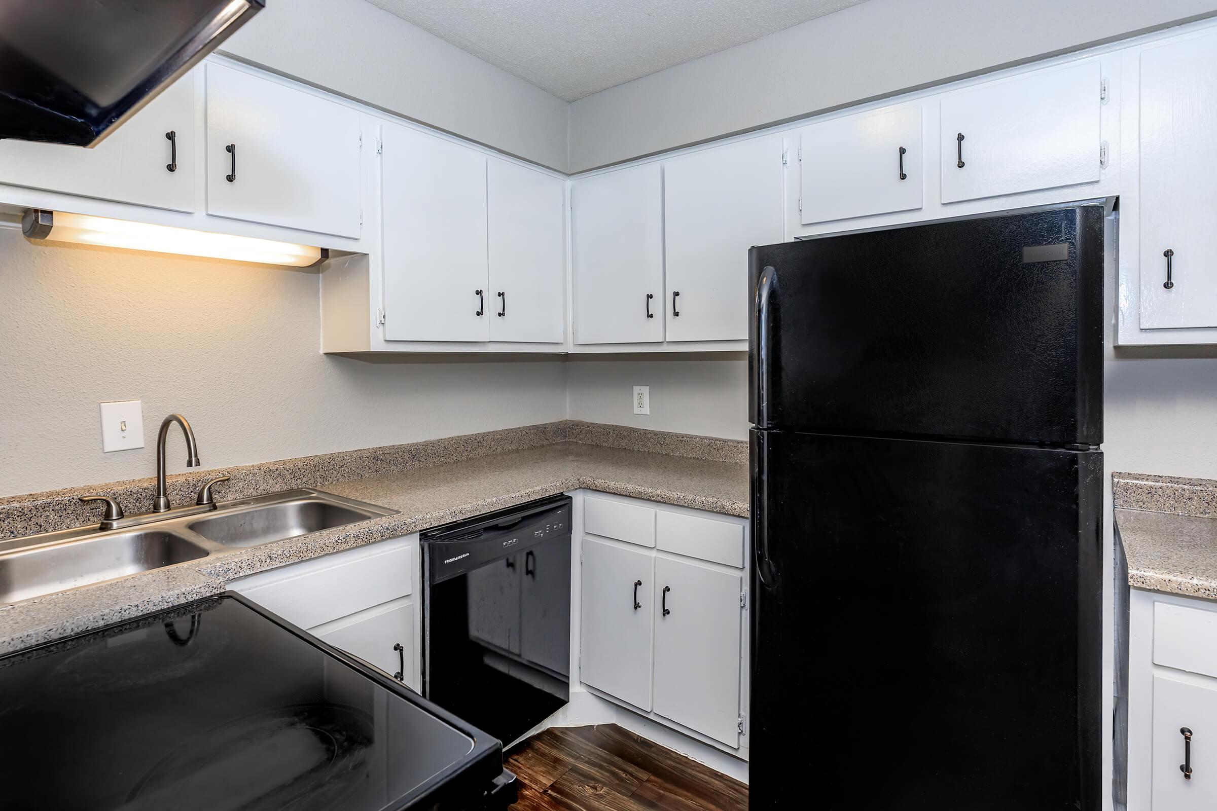 a kitchen with a sink and a microwave