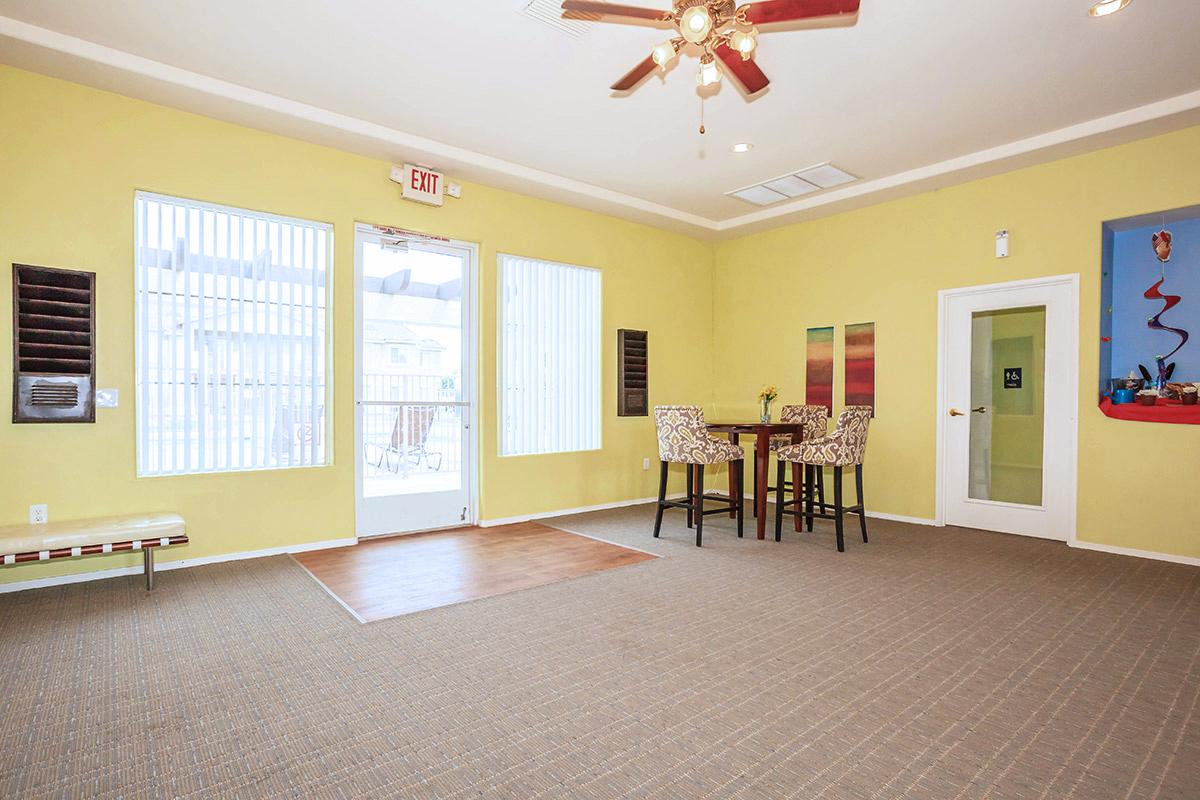 a living room filled with furniture and a flat screen tv