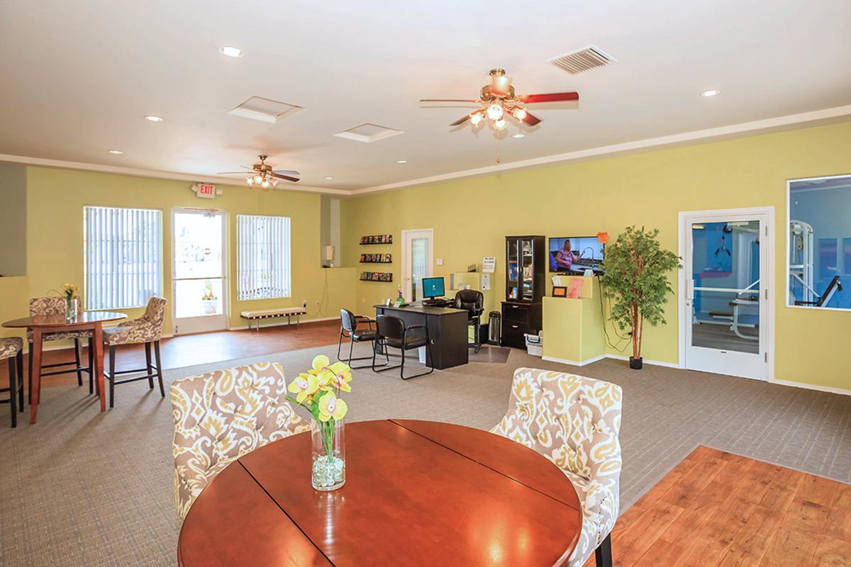 a living room filled with furniture and a flat screen tv