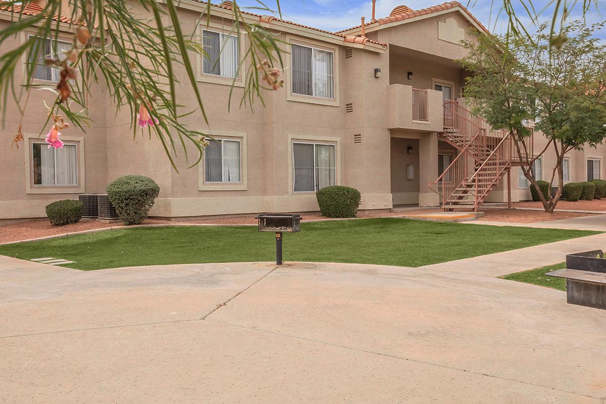 a palm tree in front of a house